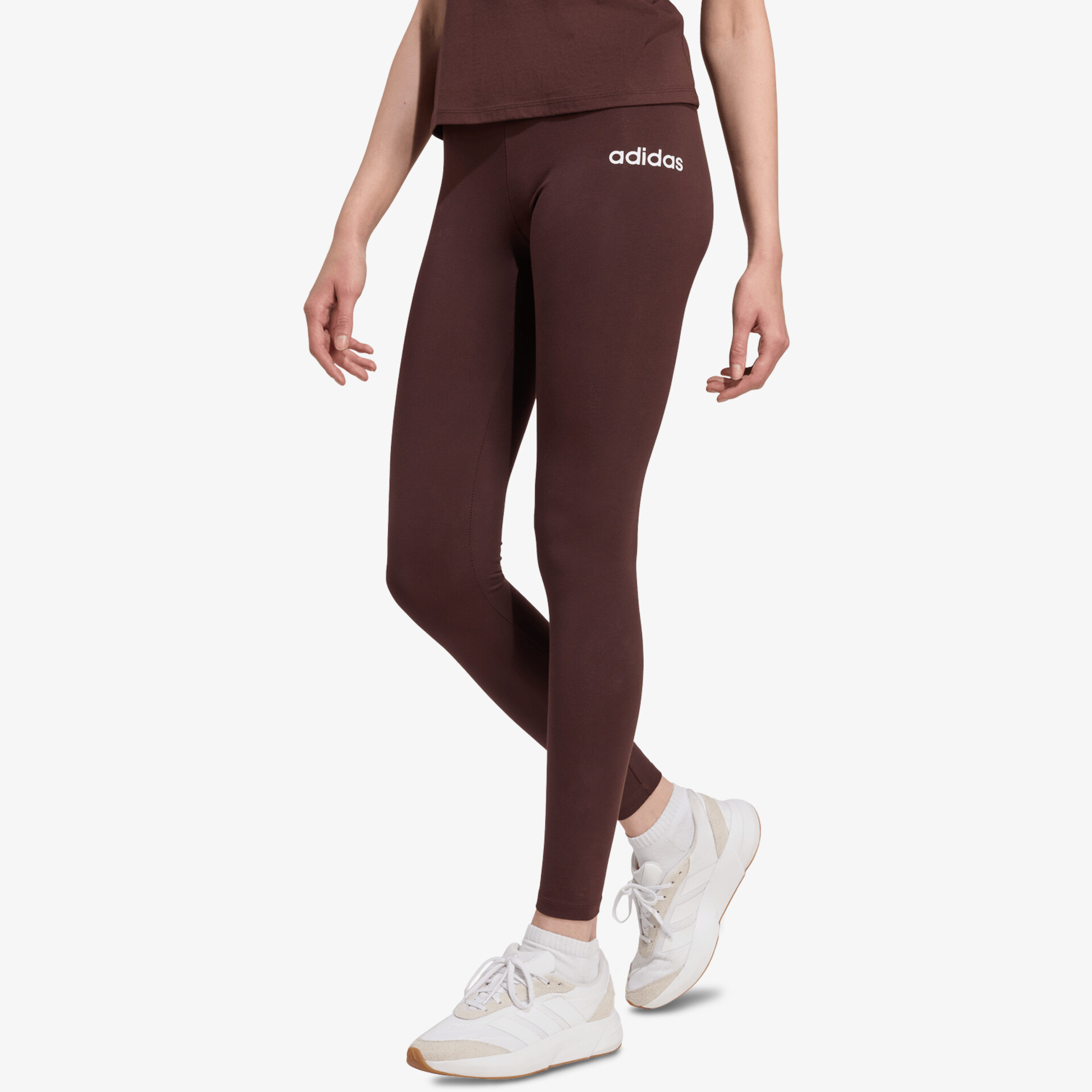 Eng anliegende sportliche Leggings in dunkler Farbe mit bequemem Schnitt und adidas-Logo vorn