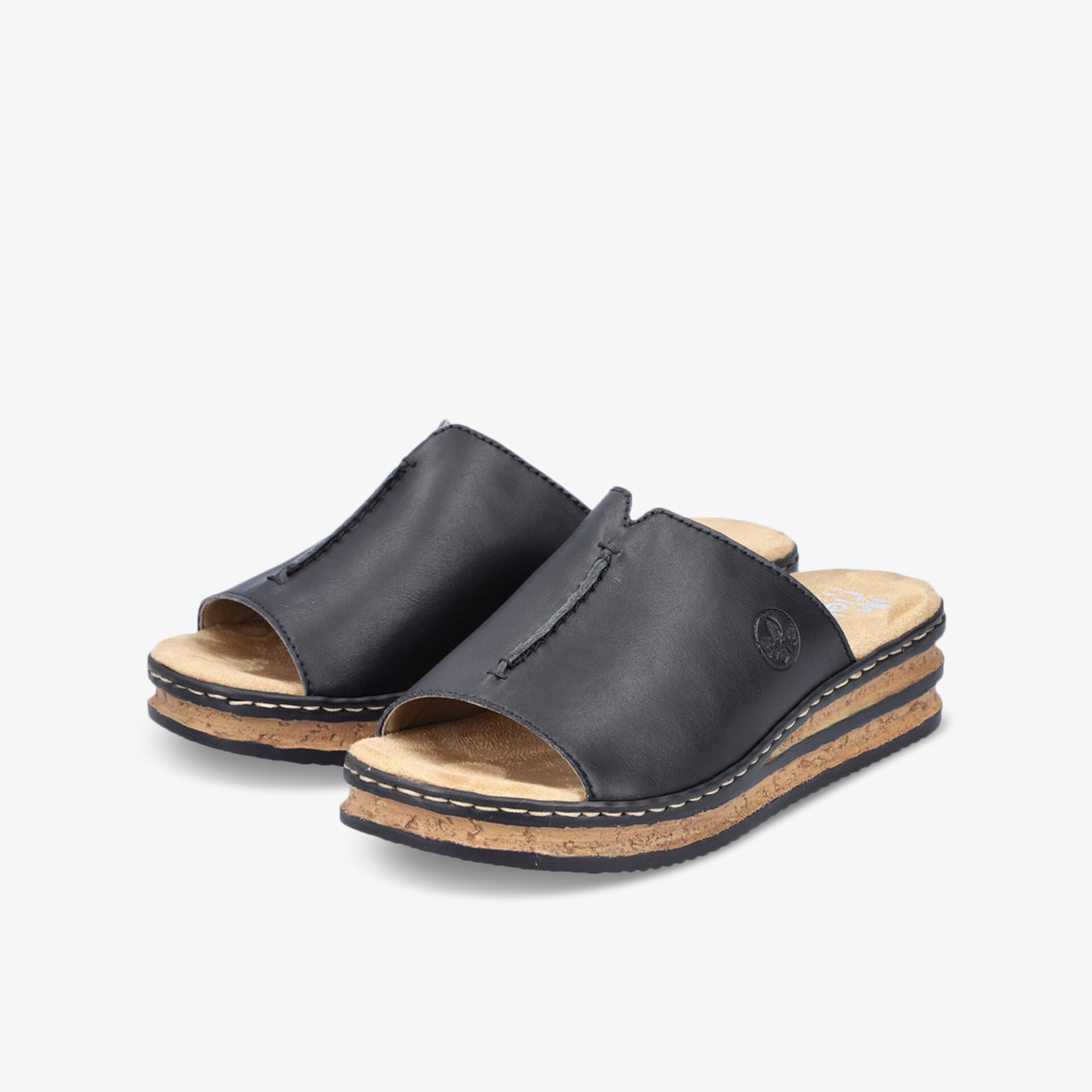 Schwarze Slipper mit weichem Fußbett und rutschfester Keilsohle für bequemen und stilvollen Tragekomfort