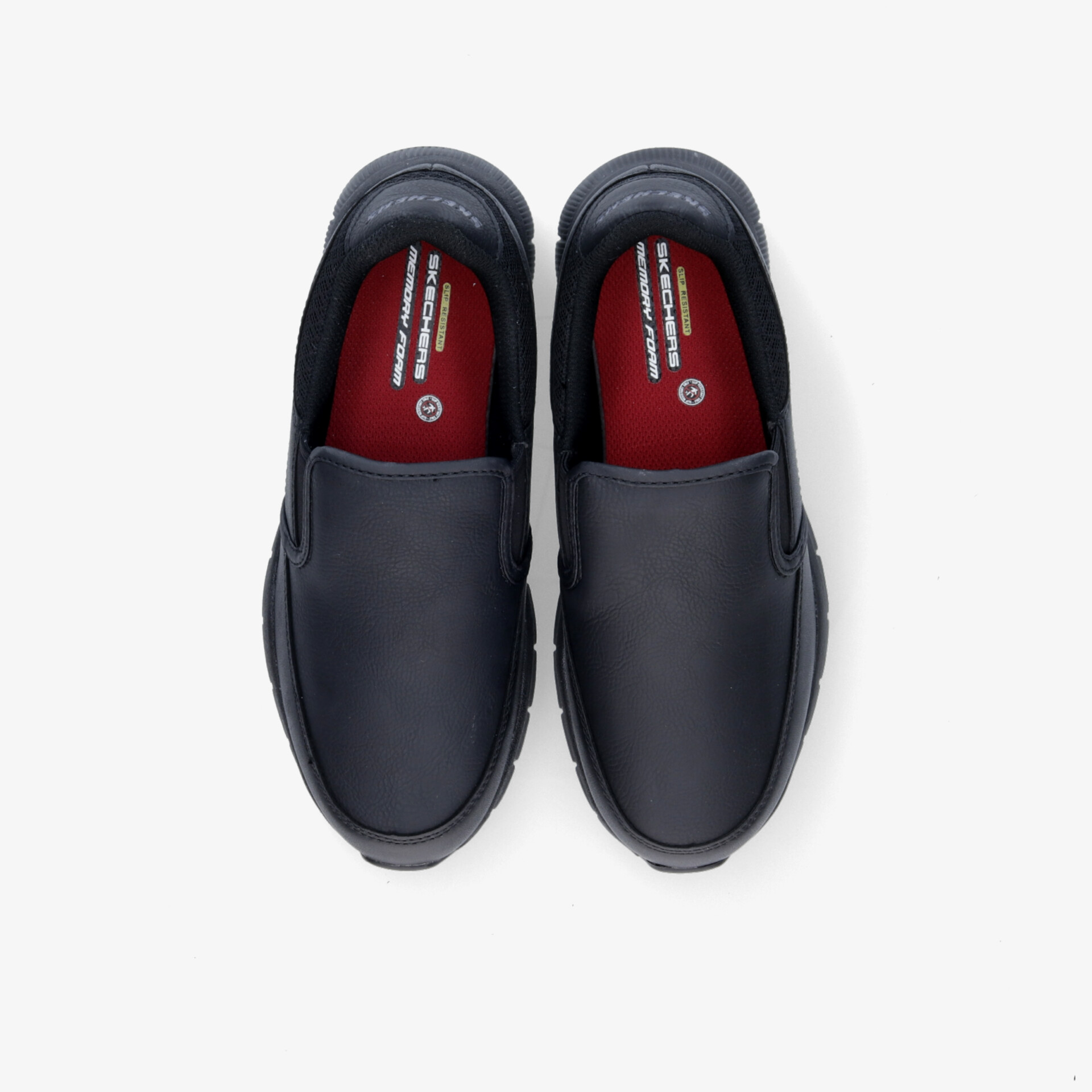 Elegante schwarze Slipper mit rotem Innenfutter, bieten Komfort und Stil in klassischem Design.