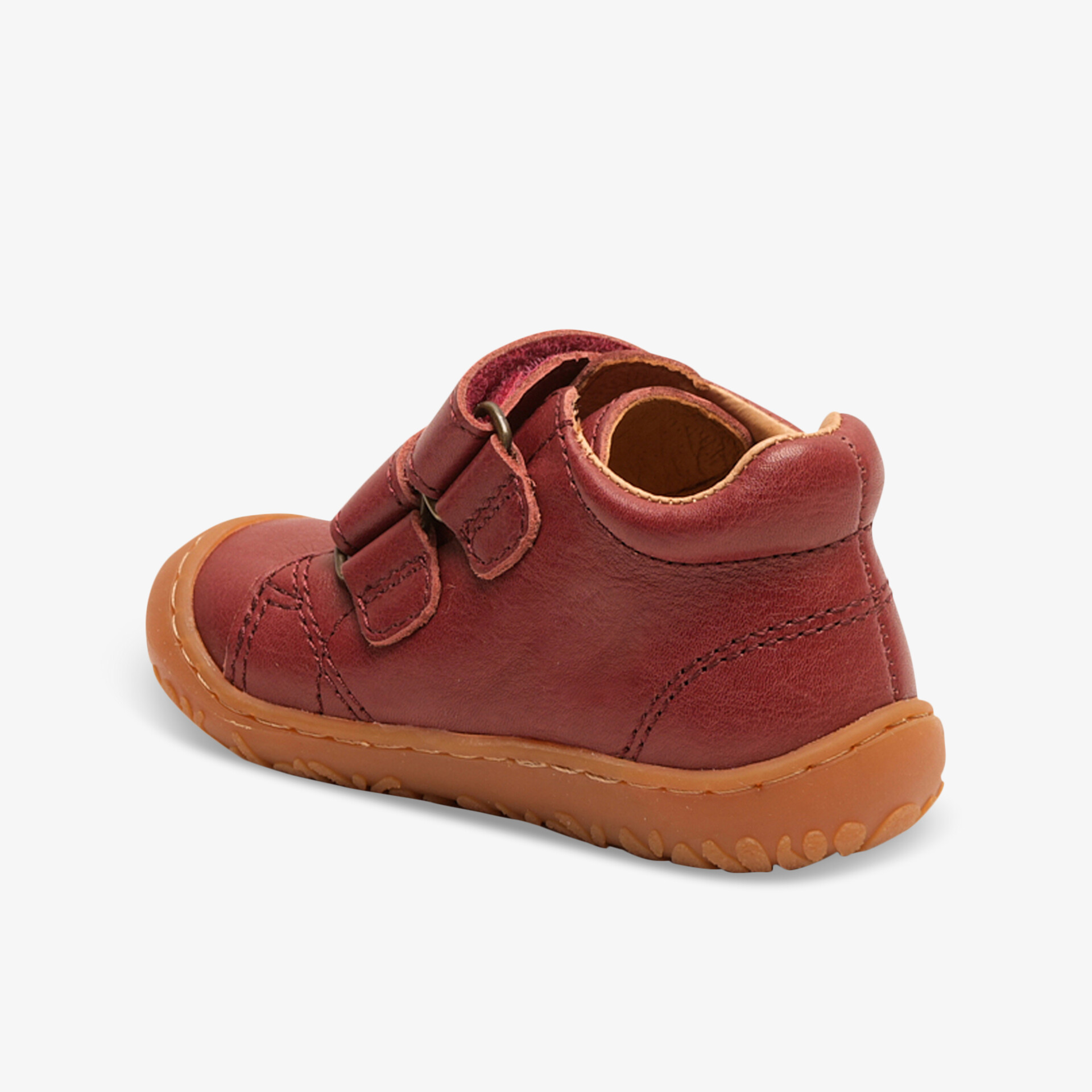 Robuster Kinderschuh in Rot mit flexibler Sohle und bequemem Klettriemen für einfachen Halt