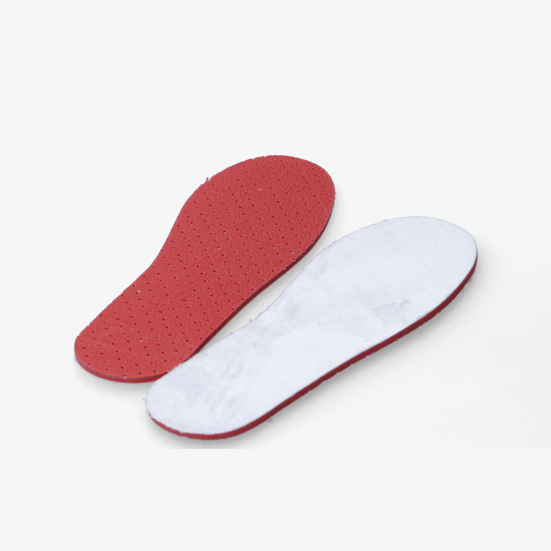 Weiche rote und weiße Einlegesohlen mit ergonomischer Form und hoher Rutschfestigkeit liegen flach