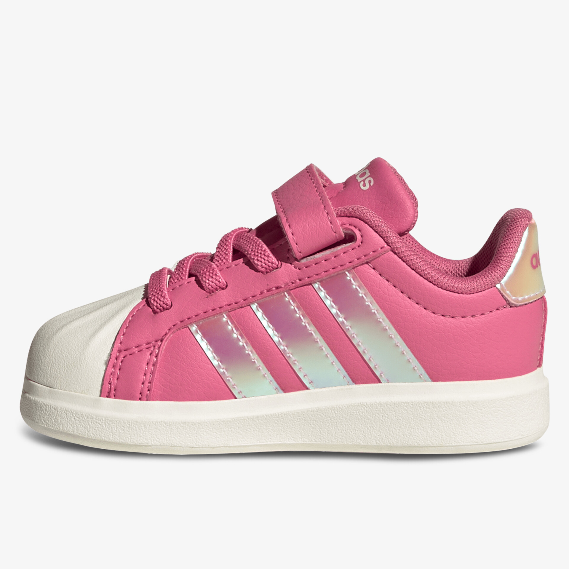 Seitliche Ansicht eines pinken Sportschuhs mit weißer Kappe und Klettverschluss für sicheren Halt