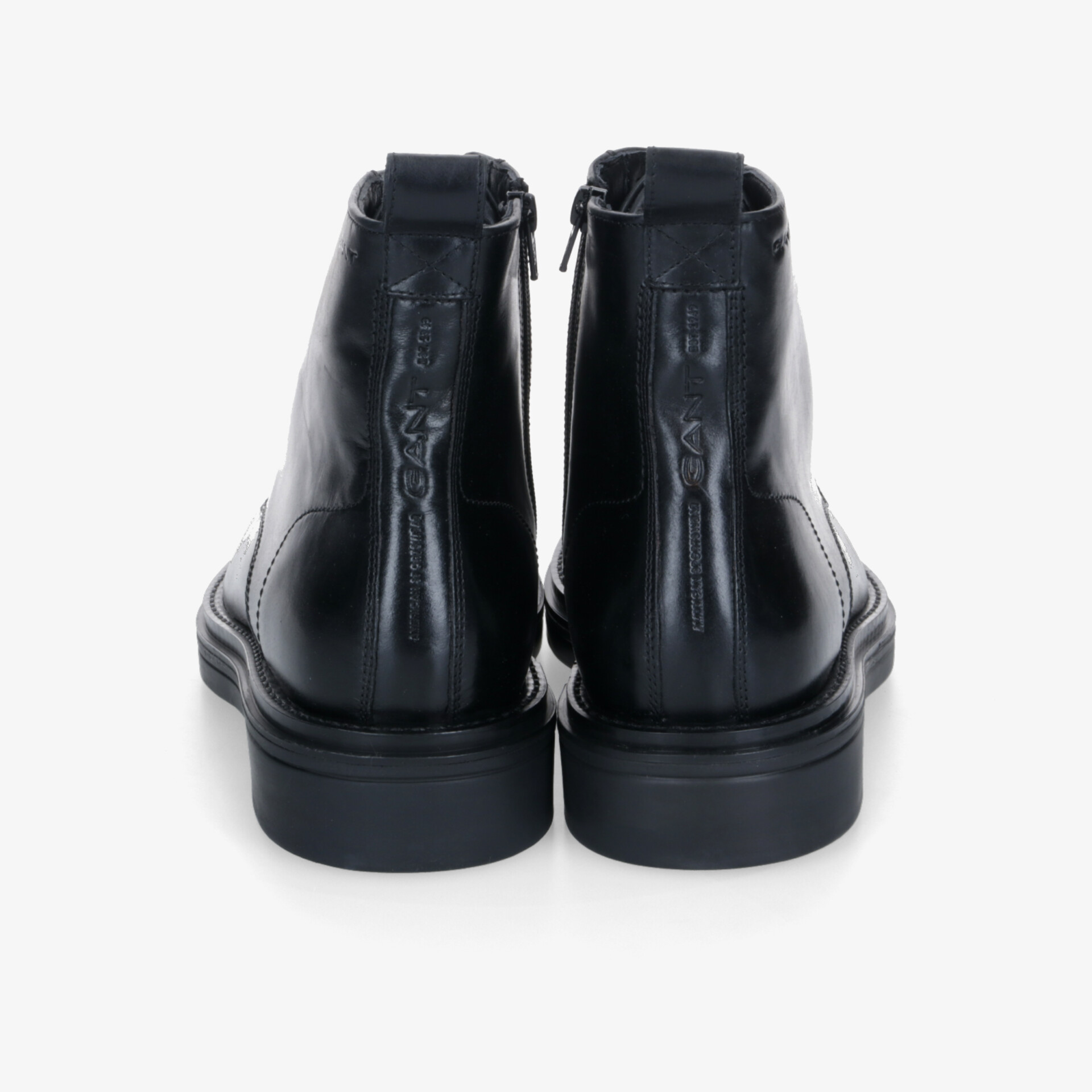 Robuste schwarze Lederstiefel mit praktischem Reißverschluss und stabiler Sohle, Rückansicht