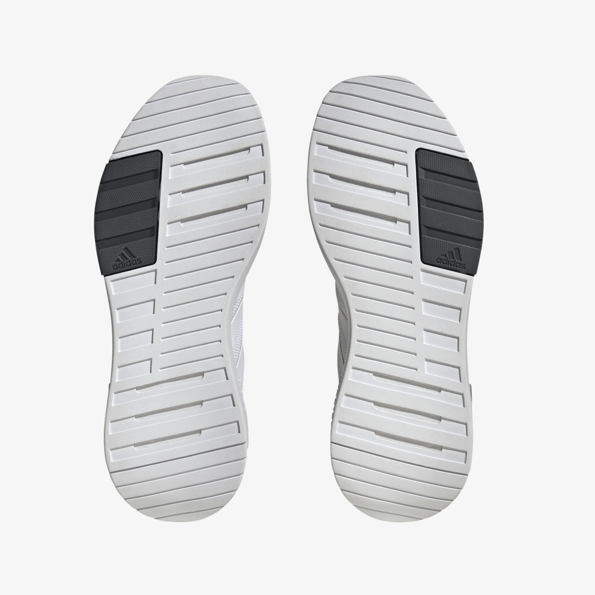 Rutschfeste graue Schuhsohlen mit hohem Grip, ideal für sportliche Aktivitäten und täglichen Komfort.