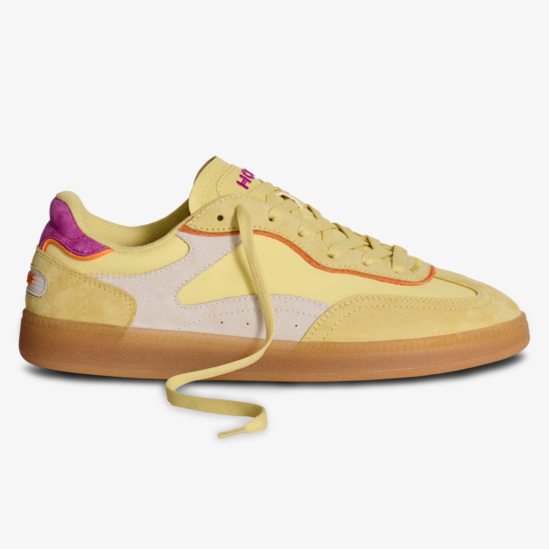 Lässiger gelber Sneaker mit pinken Akzenten und robuster Gummisohle für täglichen Komfort.