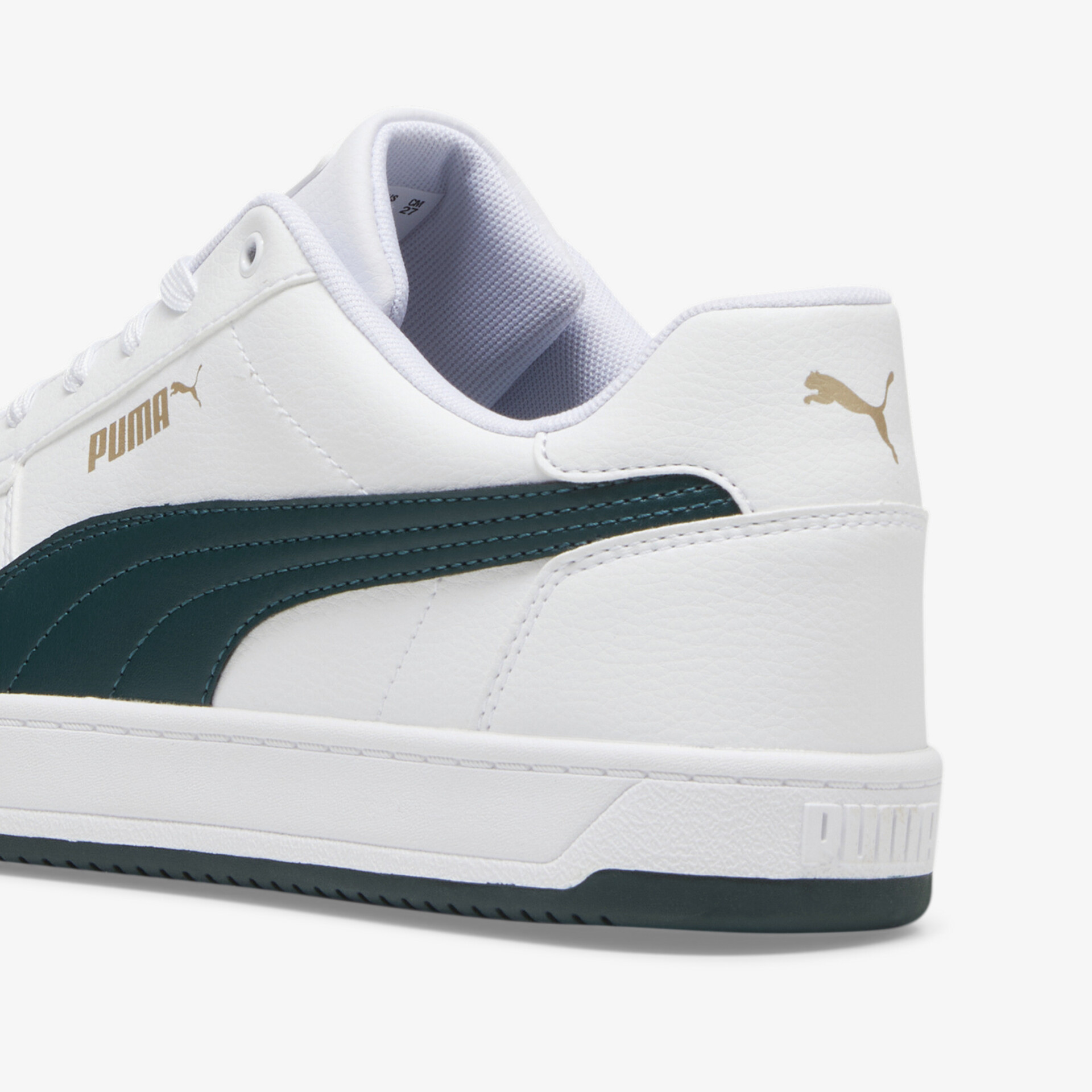 Seitliche Ansicht eines weißen Sneakers mit dunkelgrünem Akzent und komfortabler Polsterung