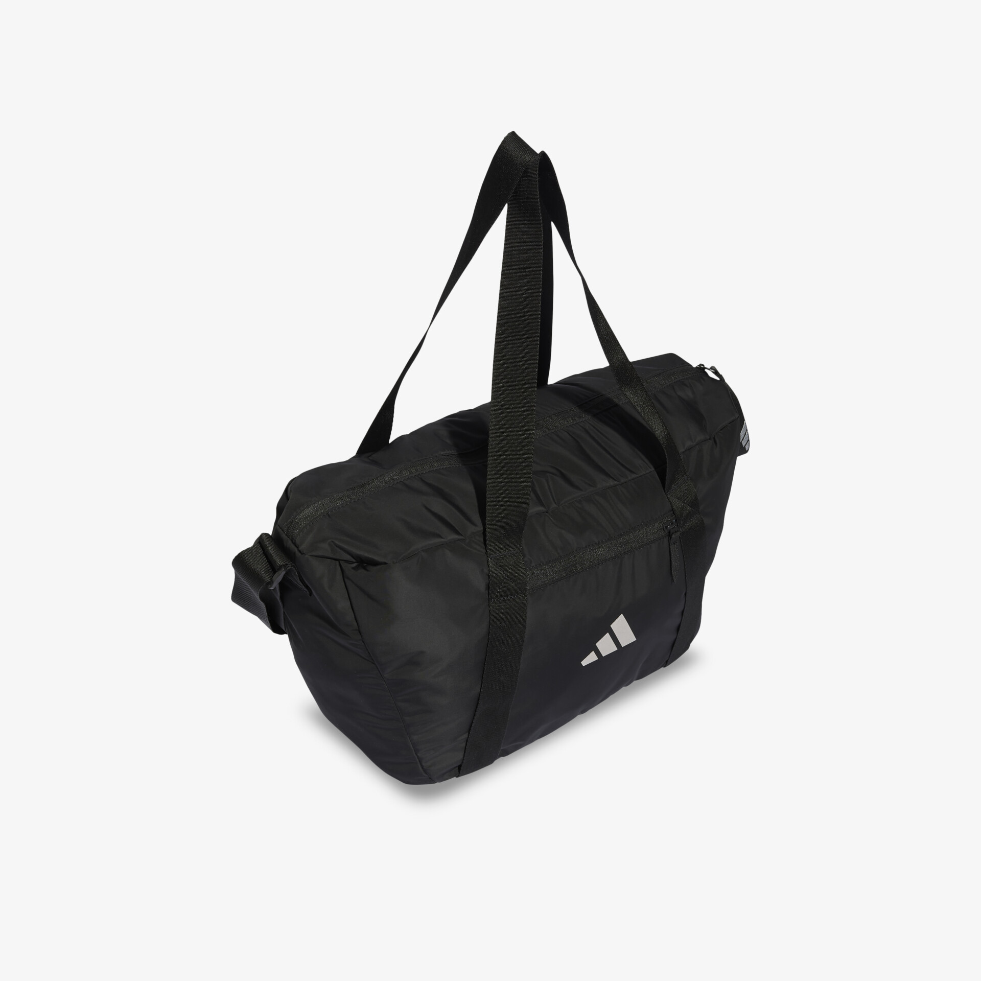 Schwarze sporttasche mit geräumigem hauptfach, robustem material und verstellbarem schultergurt für einfache tragbarkeit