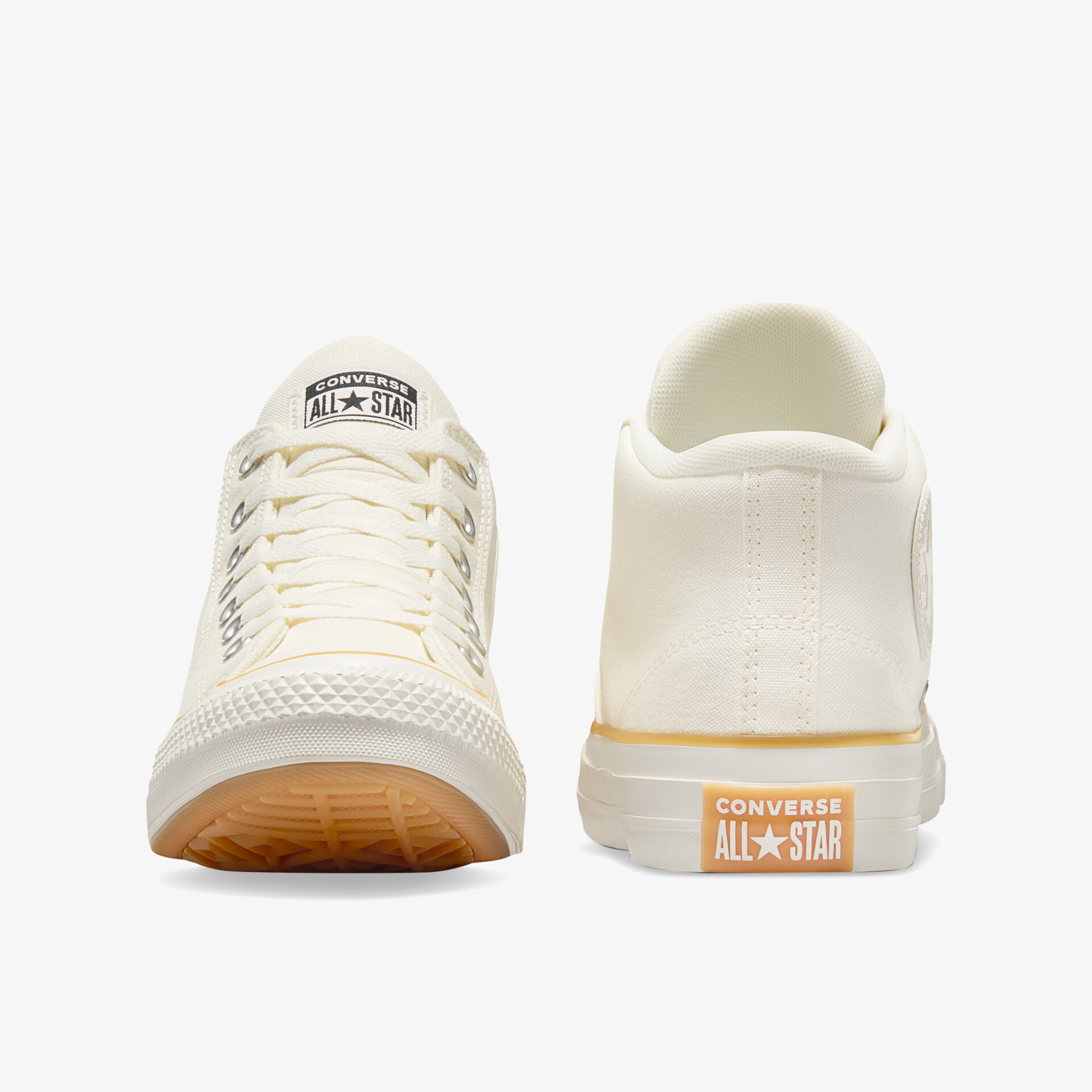 Weiße Sneaker in Front- und Rückansicht mit robuster Gummisohle und klassischem Design