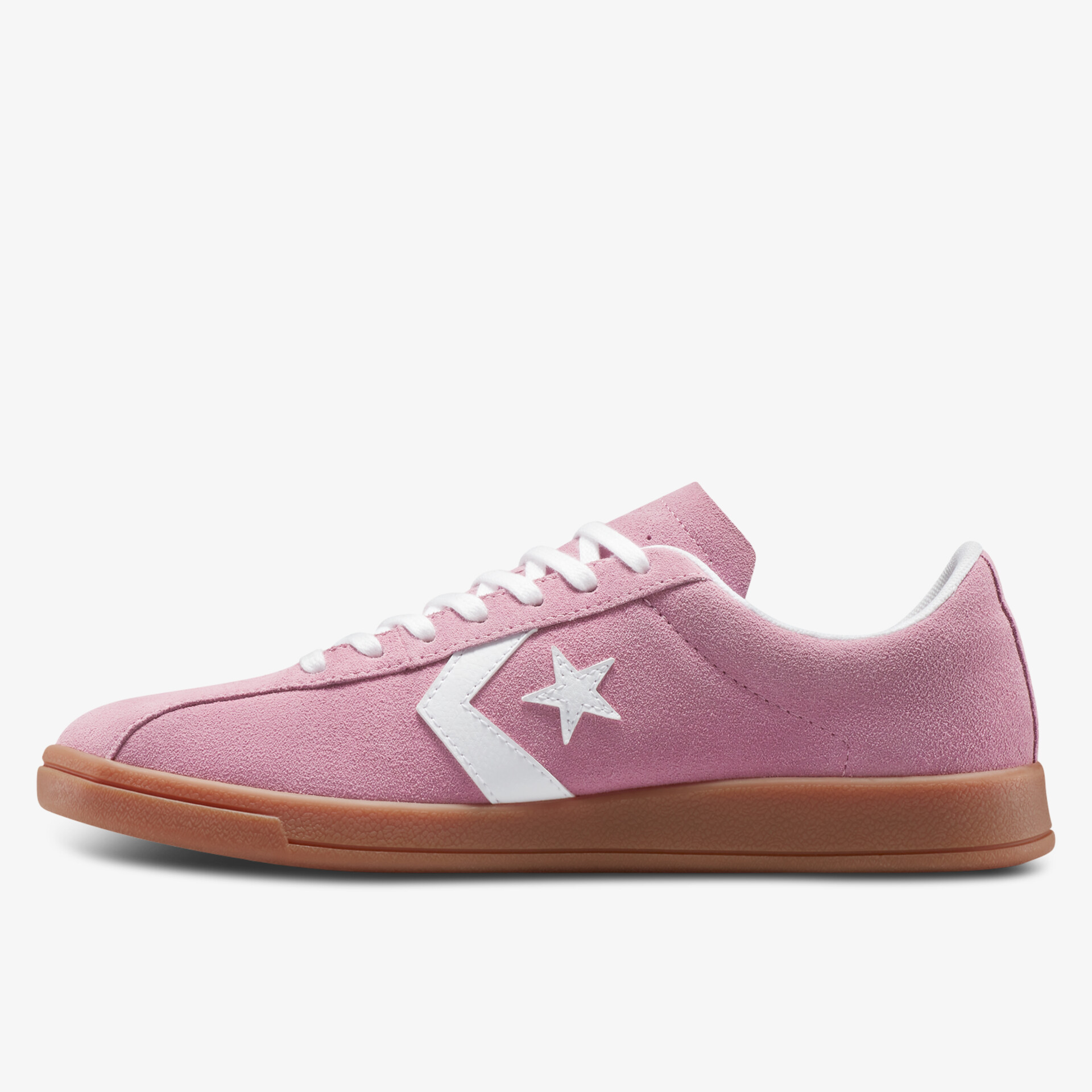 Seitliche Ansicht eines rosafarbenen Sneakers mit weißem Stern und Gummisohle, sportlich und bequem