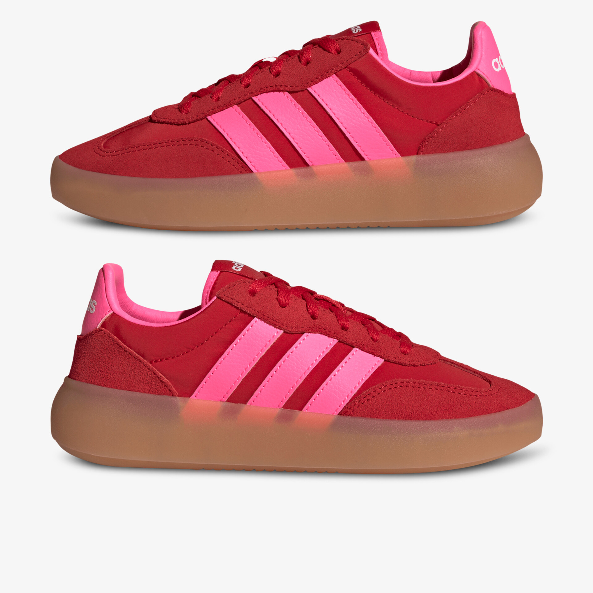 Rote Sneaker mit pinken Streifen und brauner Gummisohle, bequem und stylisch