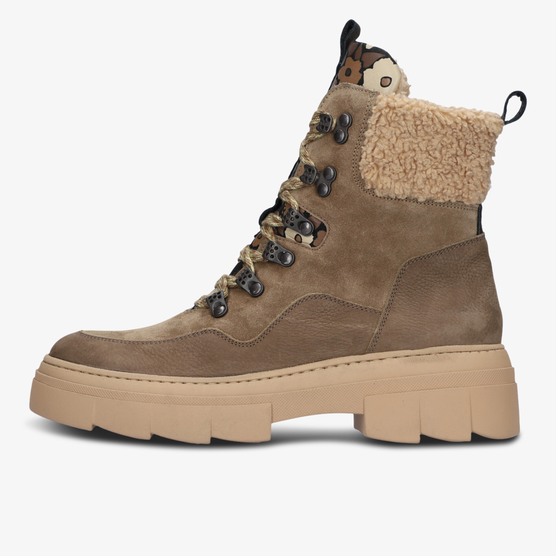Side view of sturdy brown outdoor boots with warm fleece collar and thick sole for reliable comfort