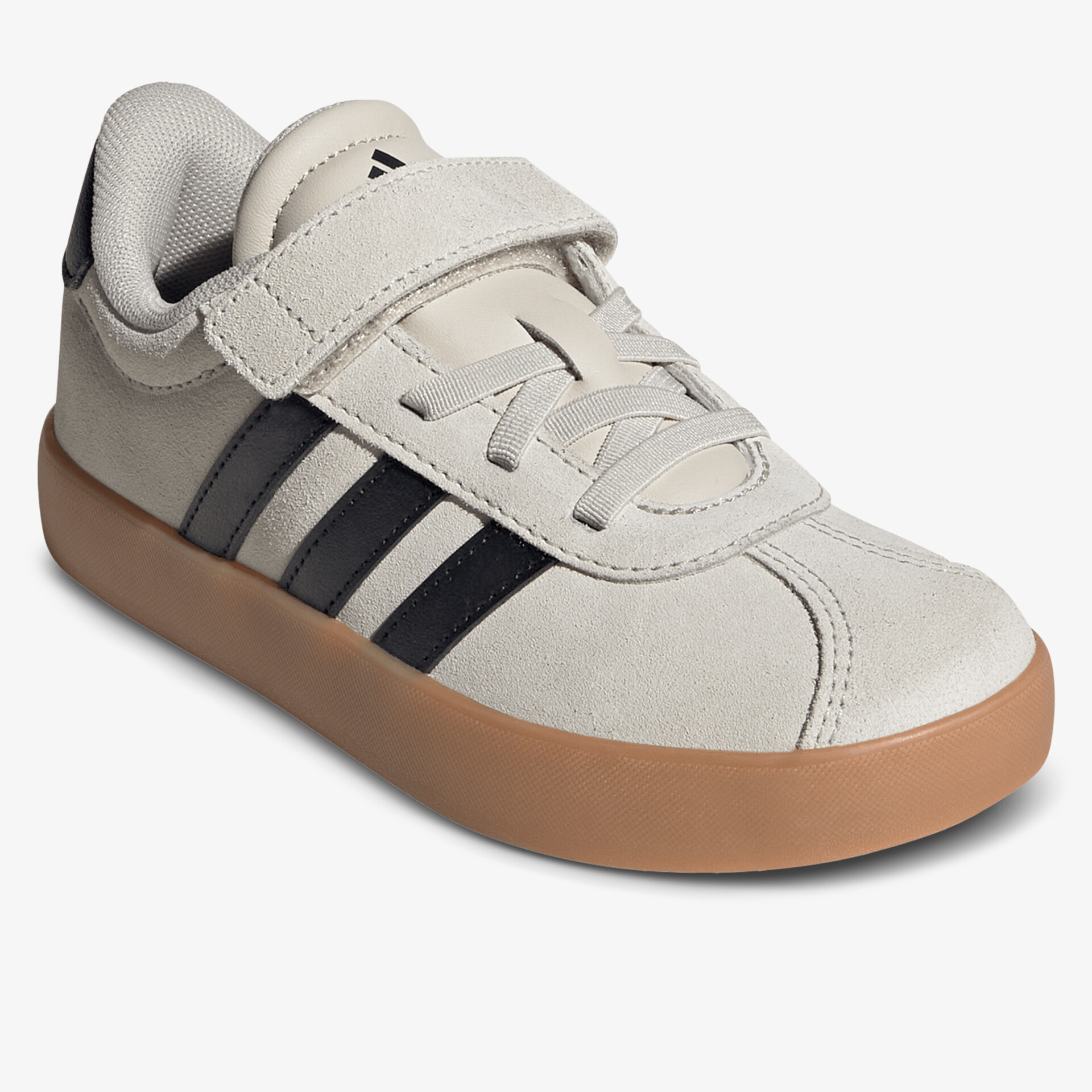 Moderner beiger Schuh mit kontrastierenden schwarzen Streifen und robuster brauner Sohle, ideal für Alltag und Freizeit