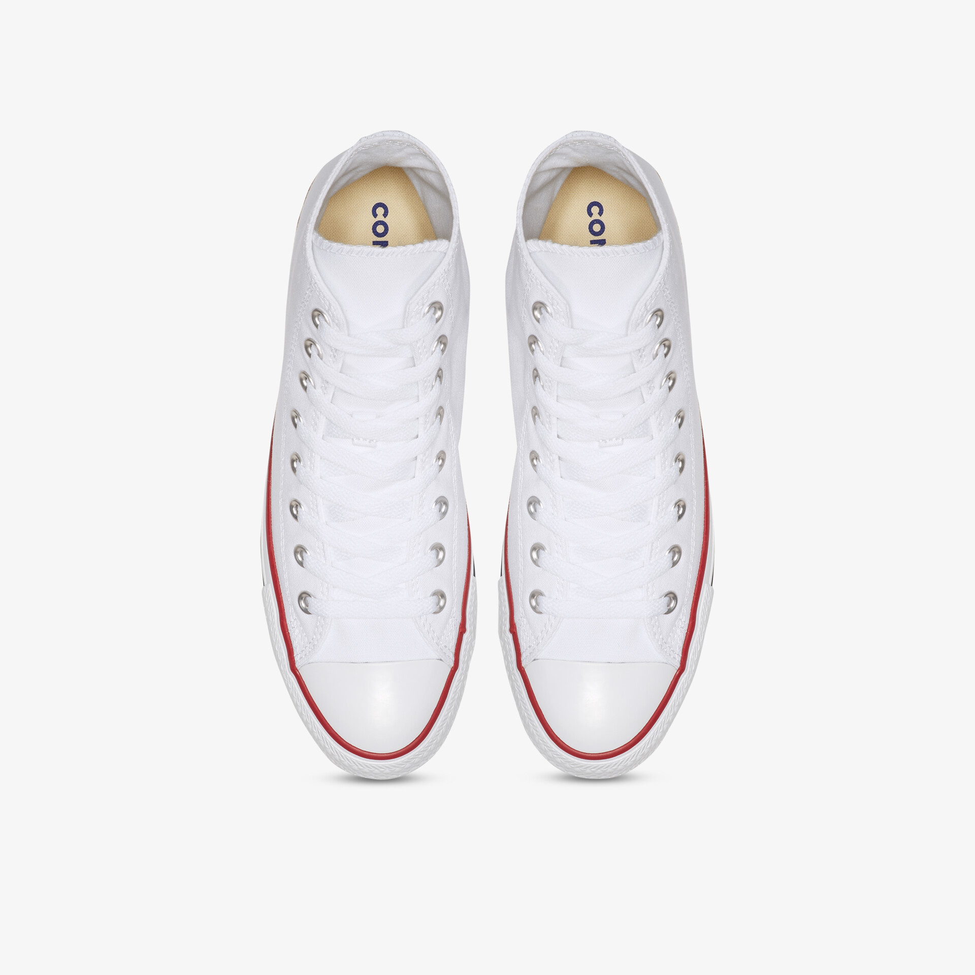 weißes Paar Sneaker elegant von oben fotografiert mit rotem Detail an der Sohle, sportlich und bequem