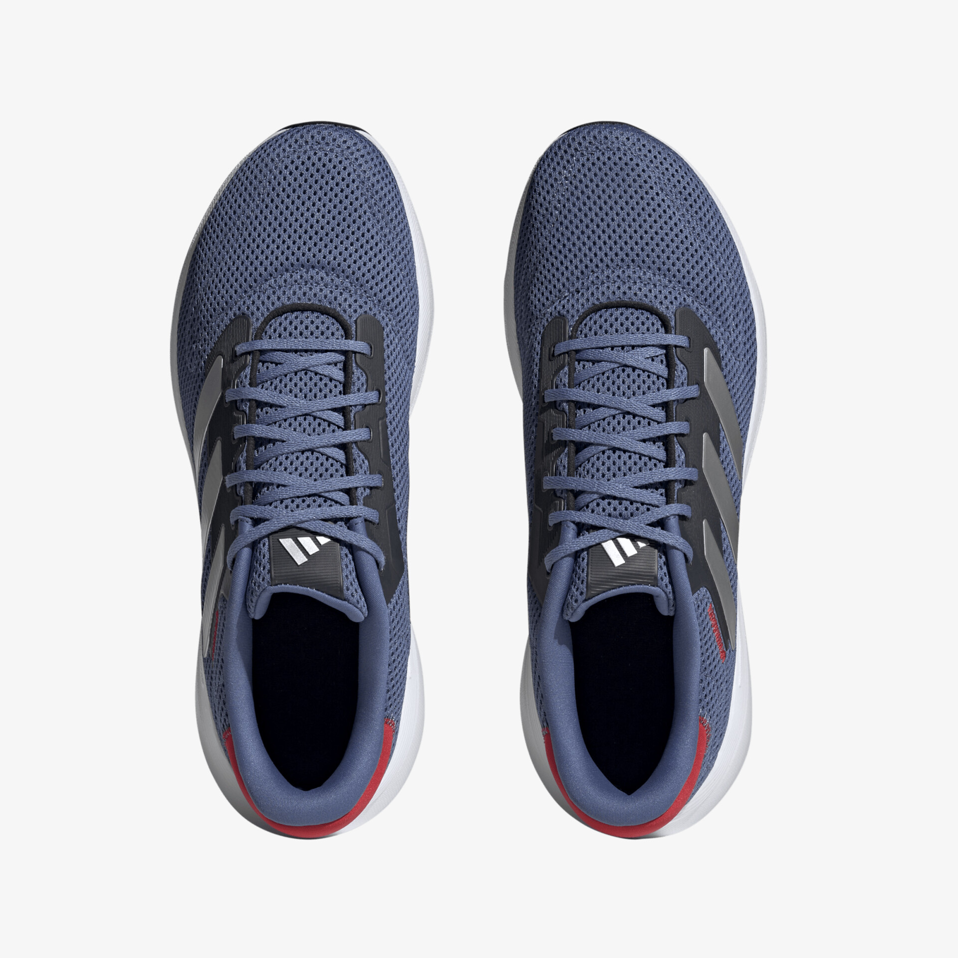 Moderne blaue Sportschuhe mit rot-weißen Akzenten und komfortabler Passform, perfekt für sportliche Aktivitäten.