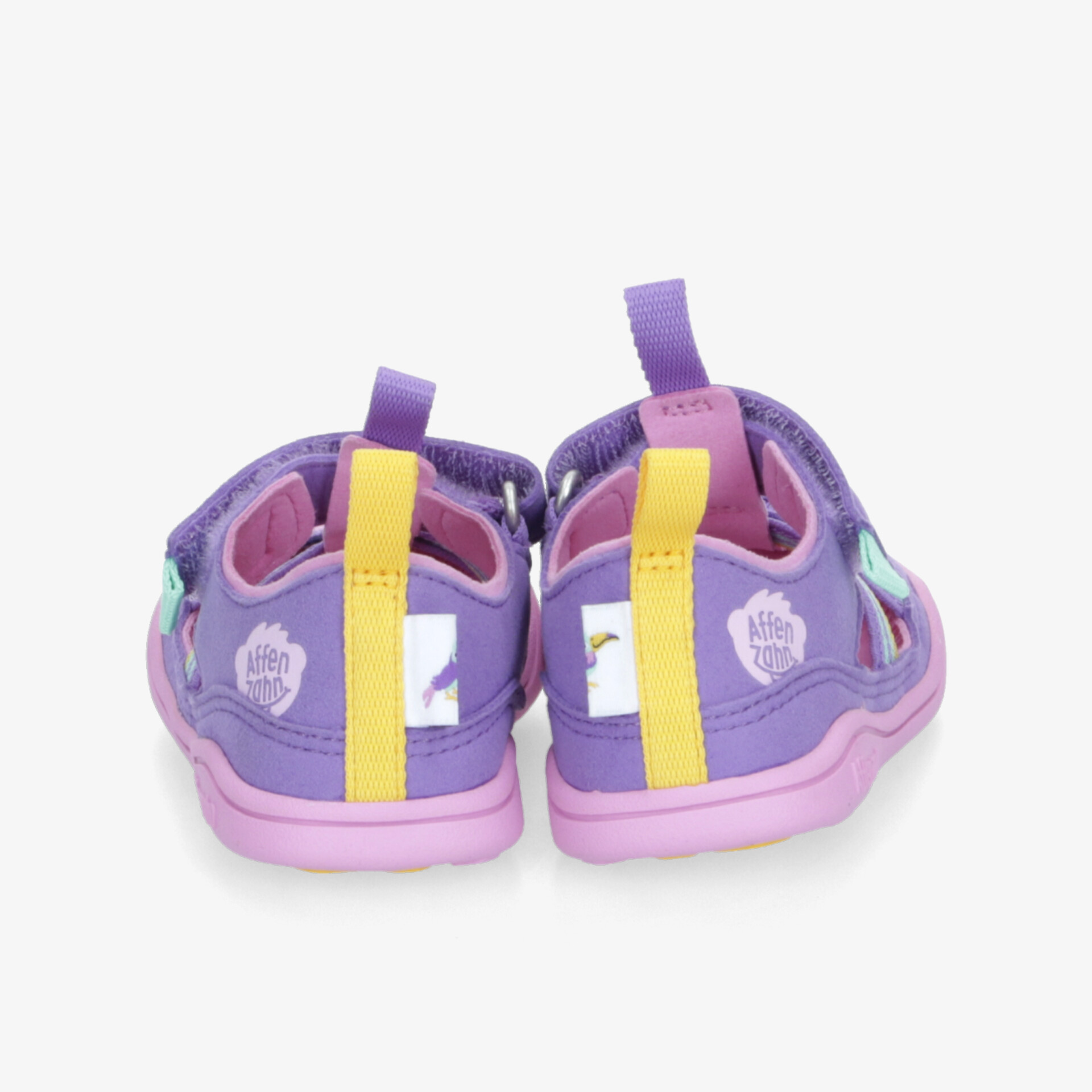 Lila Sandalen mit gelben und rosa Details, ideal für Freizeitaktivitäten, bieten Komfort und Stil.