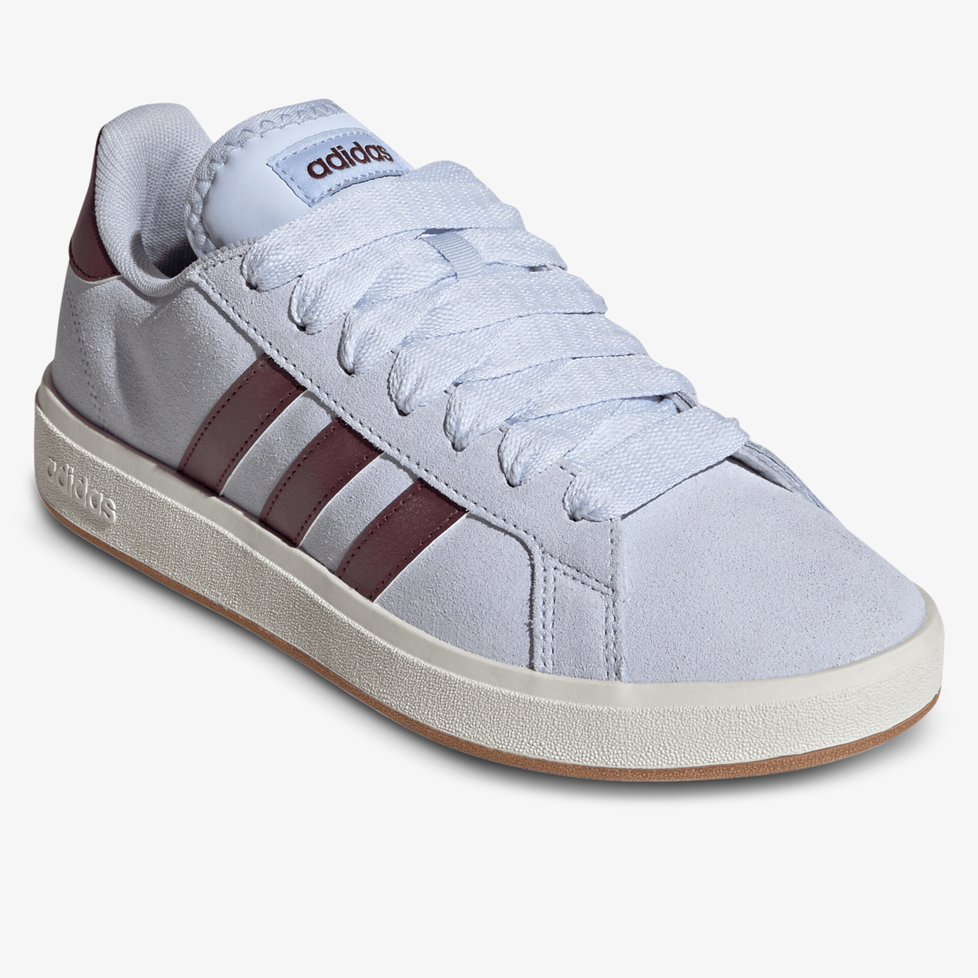 Weißer Sneaker mit markanten dunklen Streifen, bequemer Schnitt und zeitloses Design für vielseitigen Einsatz