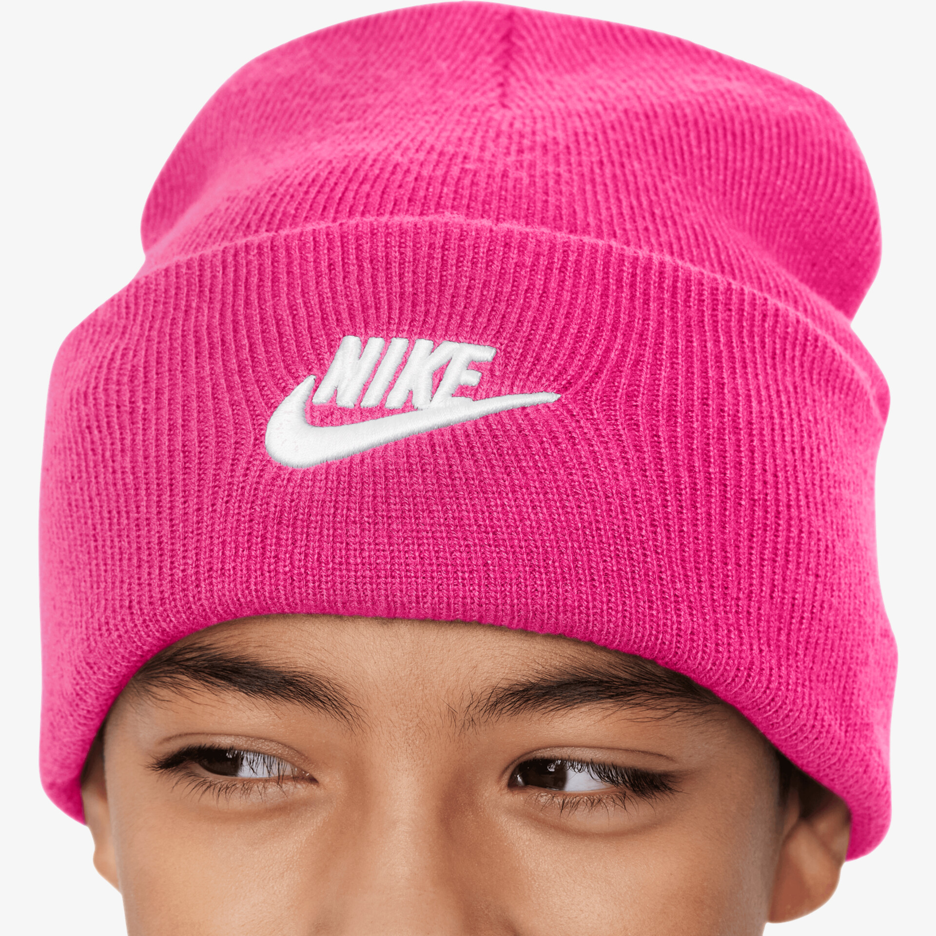 Pink knit beanie with white Nike logo, warm and cozy winter accessory, comfortable fit