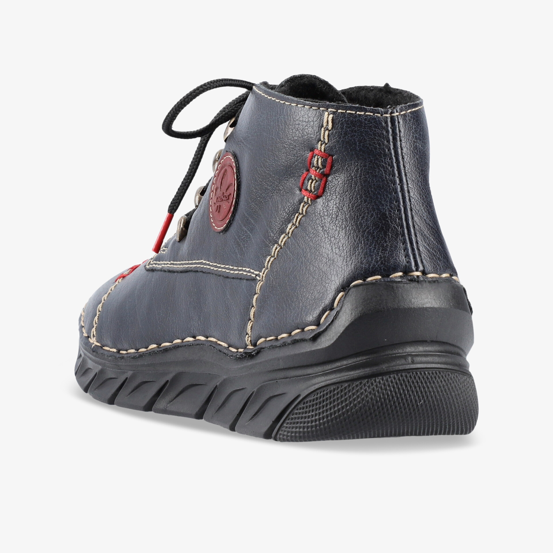 Seitliche Ansicht eines robusten, komfortablen Schuhs mit gepolsterter Innensohle und modischen Nahtdetails