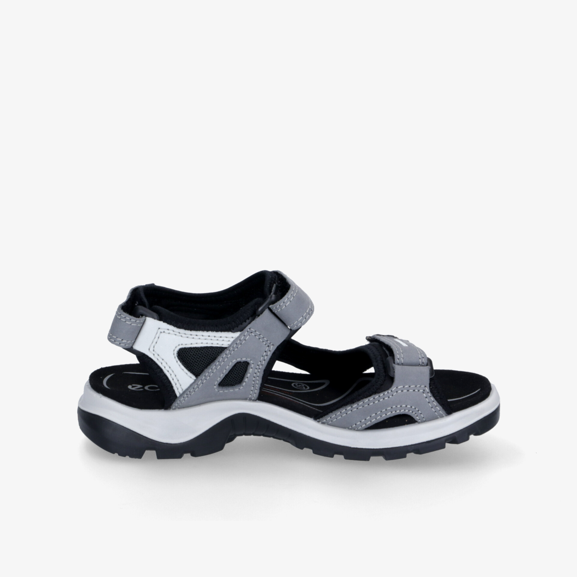 Seitliche Ansicht einer sportlichen Sandale mit verstellbarem Klettverschluss und rutschfester Sohle für Outdoor-Aktivitäten