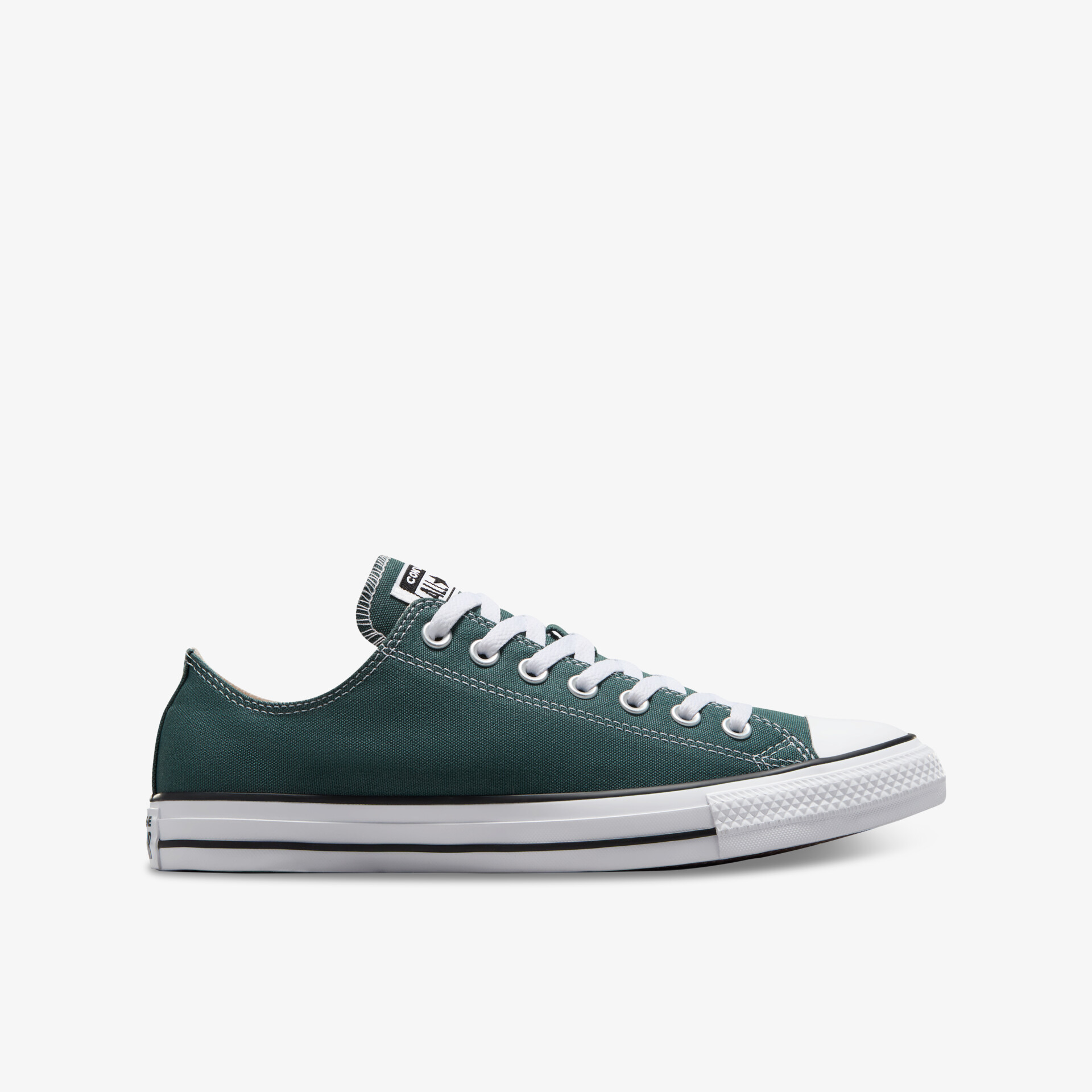 Seitliche Ansicht eines grünen Sneakers mit weißer Gummisohle und weißen Schnürsenkeln, sportlich und bequem