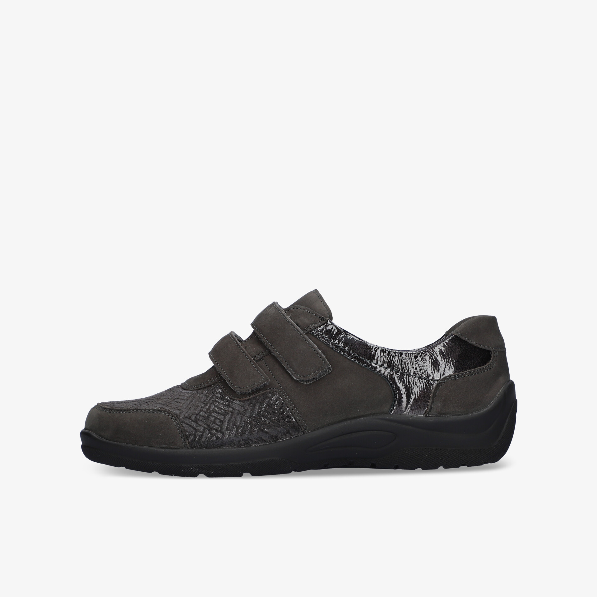 Bequemer Schuh mit praktischem Klettverschluss und gepolsterter Sohle für Alltagskomfort und Stabilität.