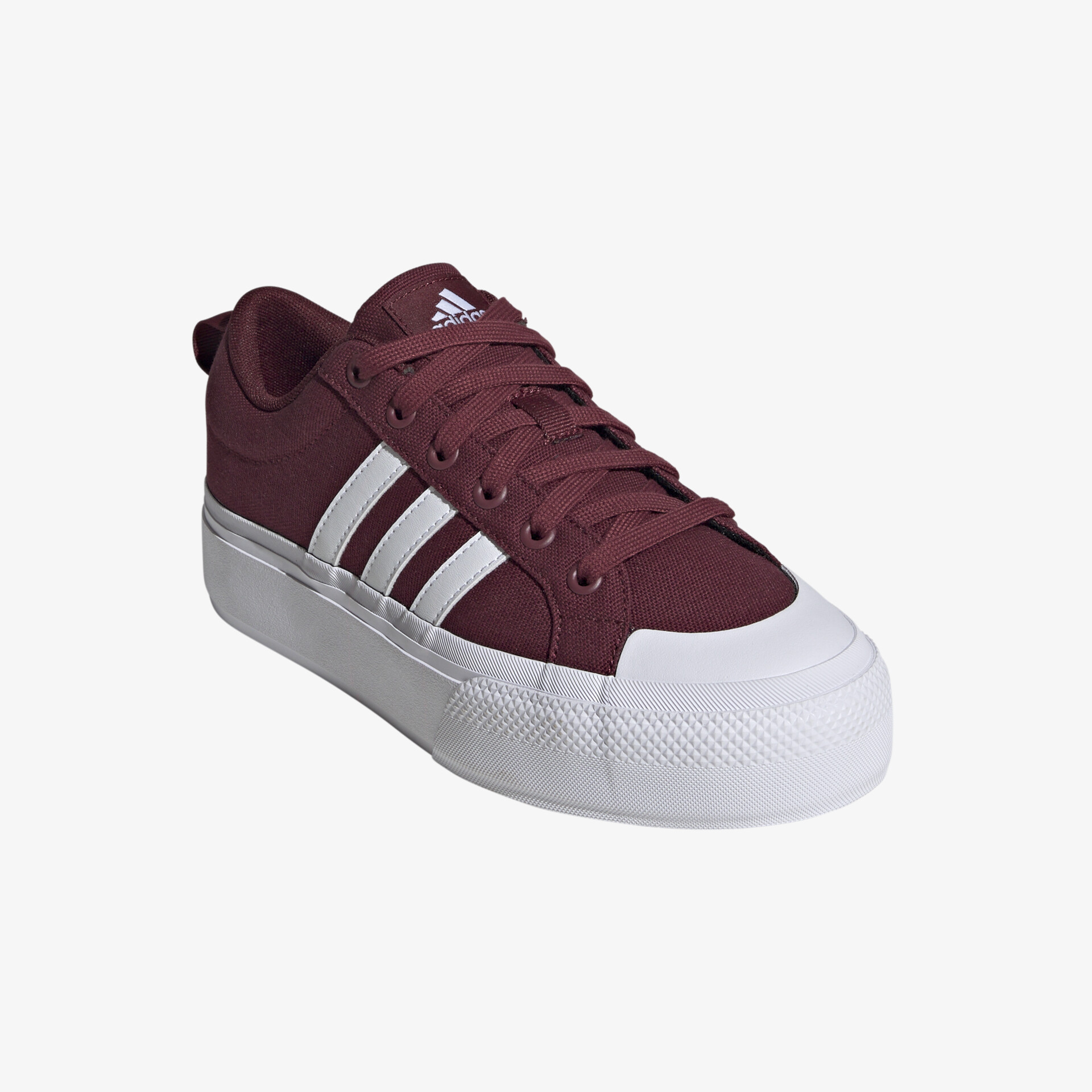 Klassischer Sneaker in kräftigem Rot mit weißer Sohle und markanten Streifen, perfekt für jeden Anlass.