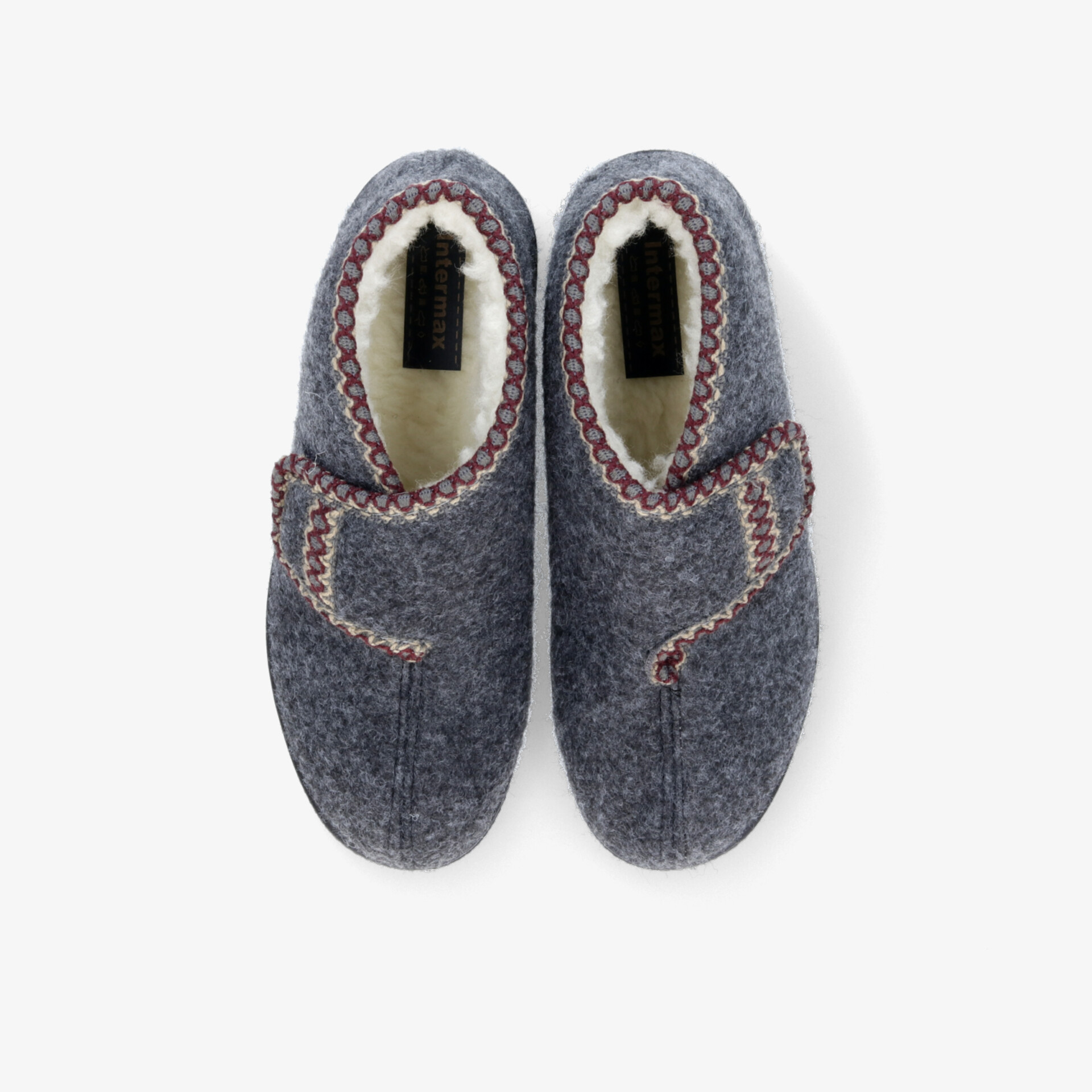 Bequeme Filzhausschuhe mit weichem Innenfutter und rutschfester Sohle in traditionellem Design von oben.
