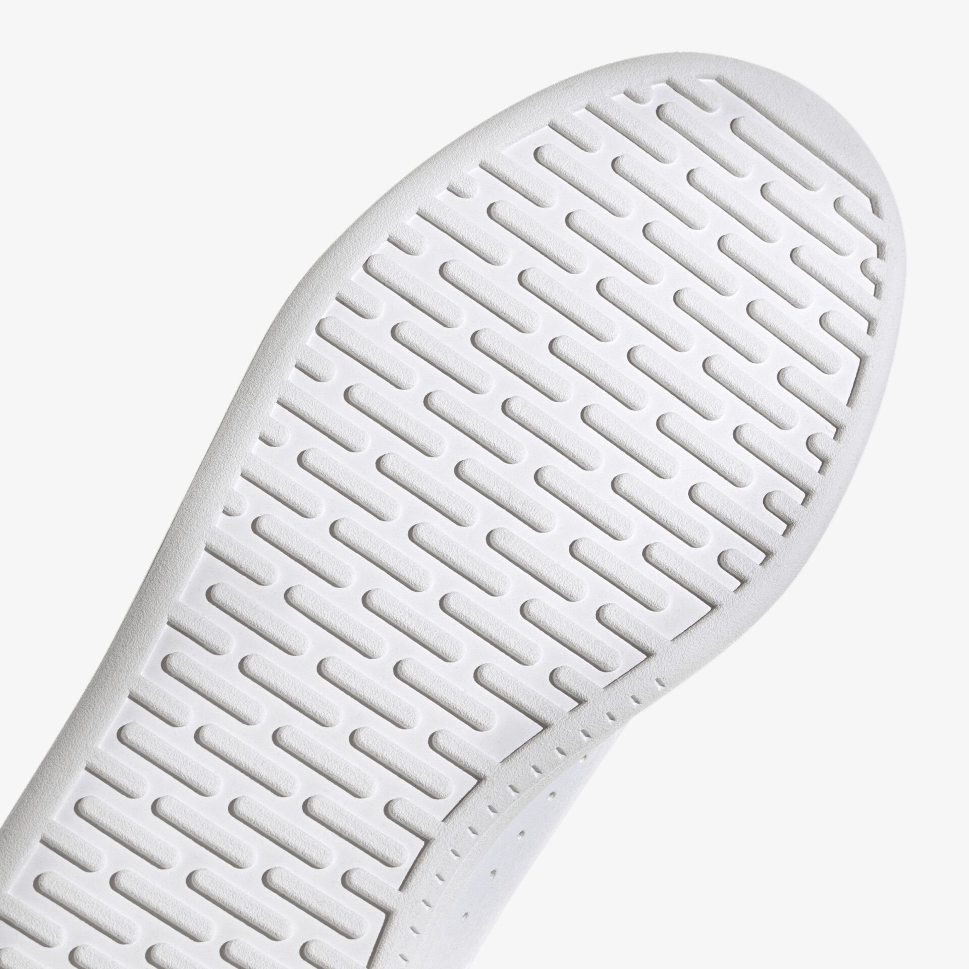 Detailaufnahme einer weißen, rutschfesten und strapazierfähigen Schuhsohle für optimale Haltbarkeit.