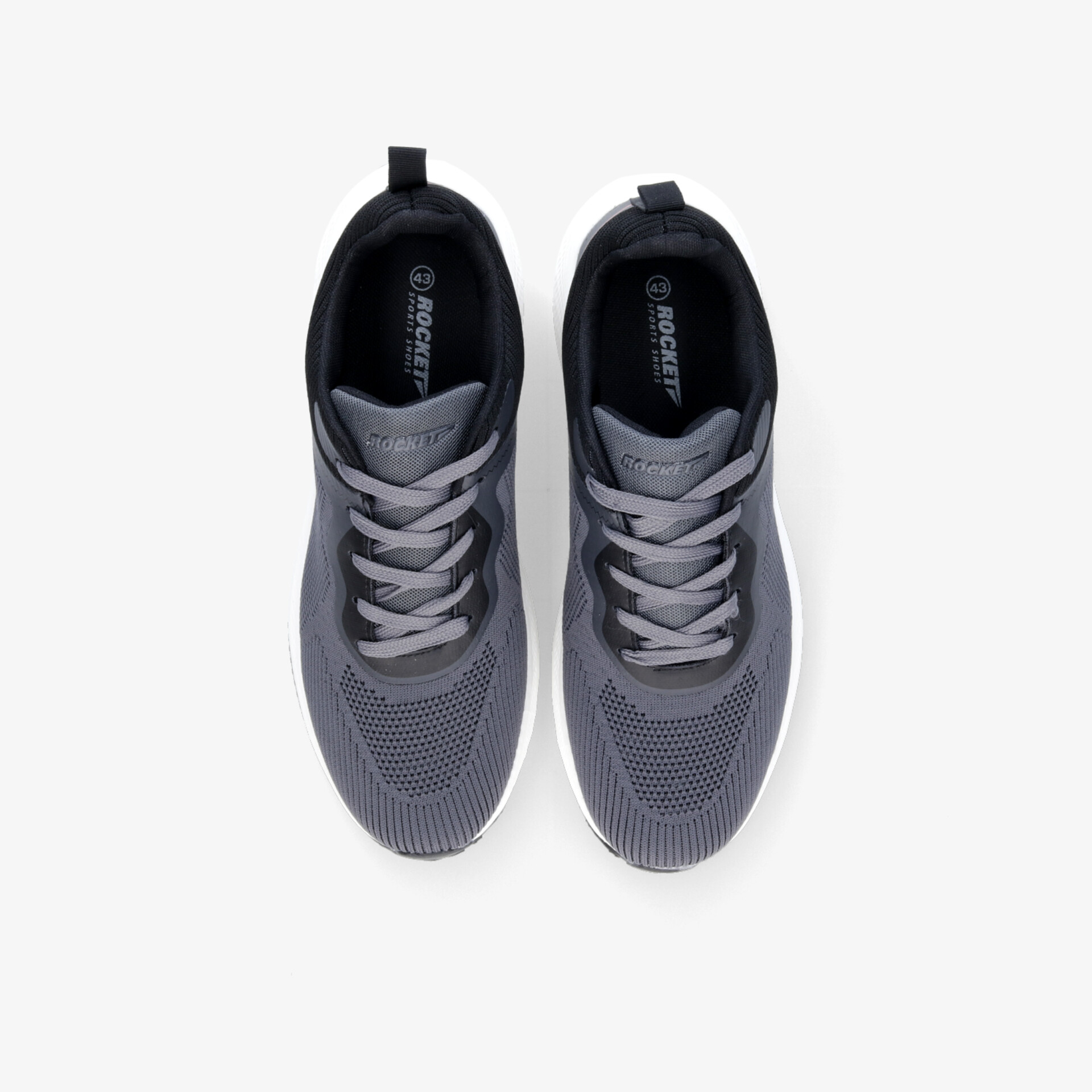 Graue sportliche Sneaker mit atmungsaktivem Material und flexibler, rutschfester Sohle, von oben betrachtet