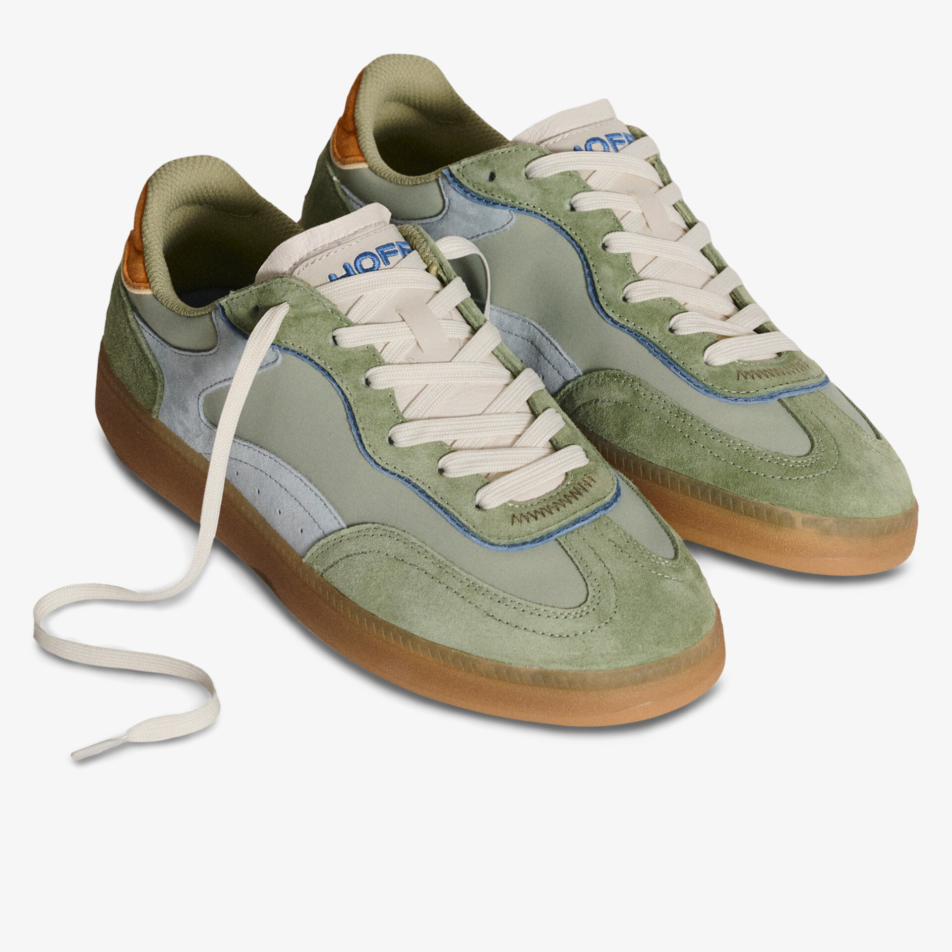 Stylish green suede sneakers with durable rubber sole and lace-up design.