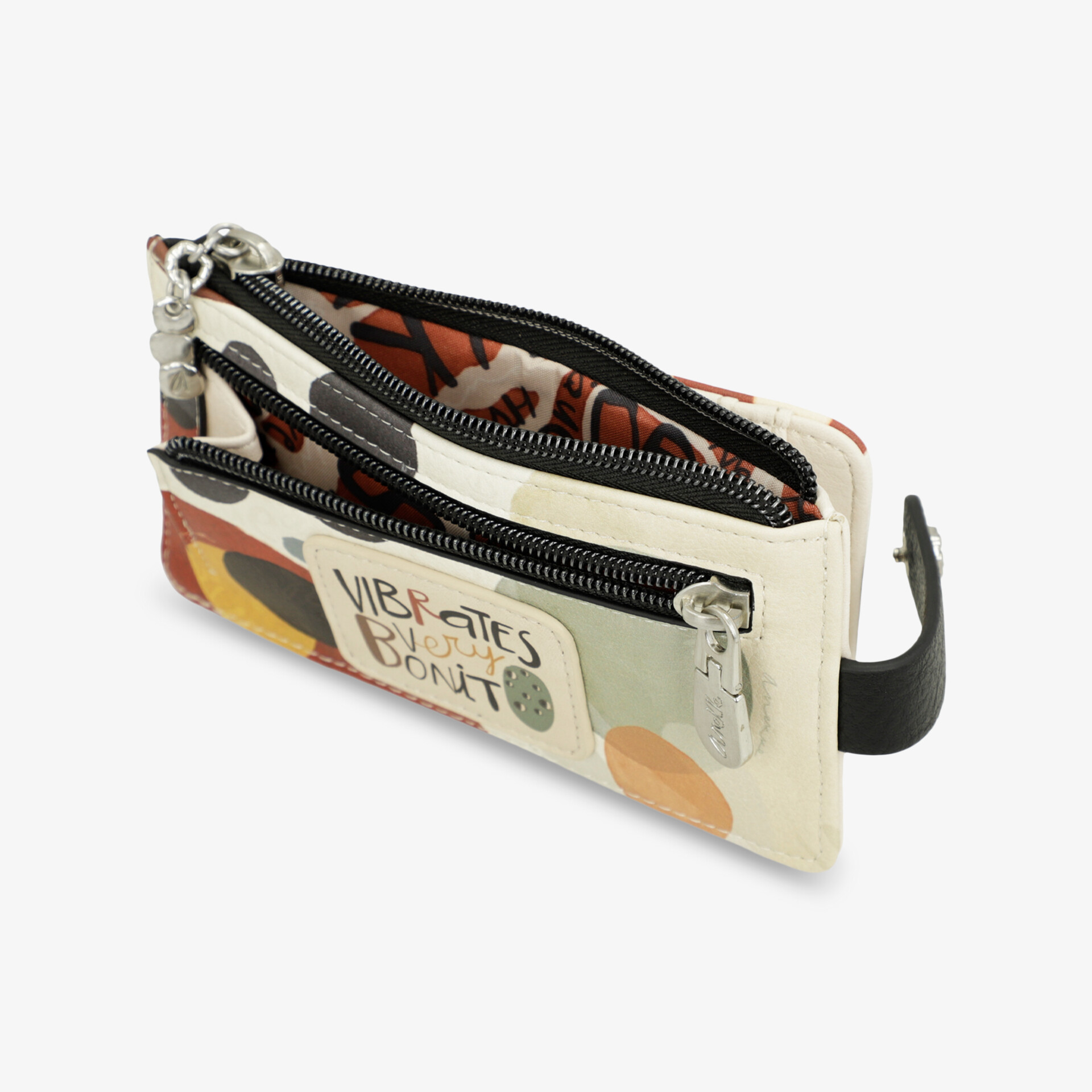 Kompakte Geldbörse mit mehreren Reißverschlussfächern und farbigem Muster, handlich und übersichtlich