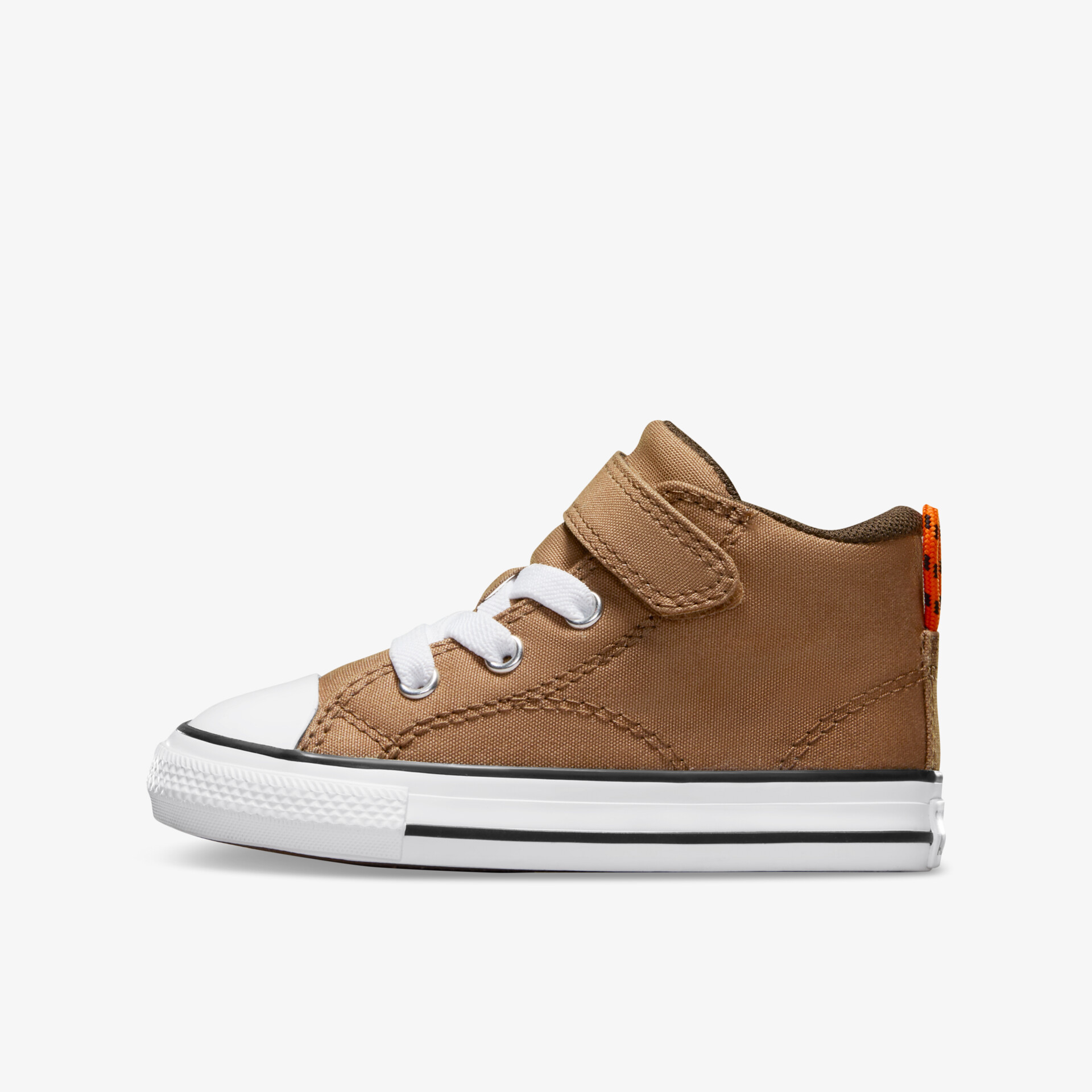 Brauner Kinderschuh mit weißer Sohle und Klettverschluss, seitliche Ansicht, robust und bequem