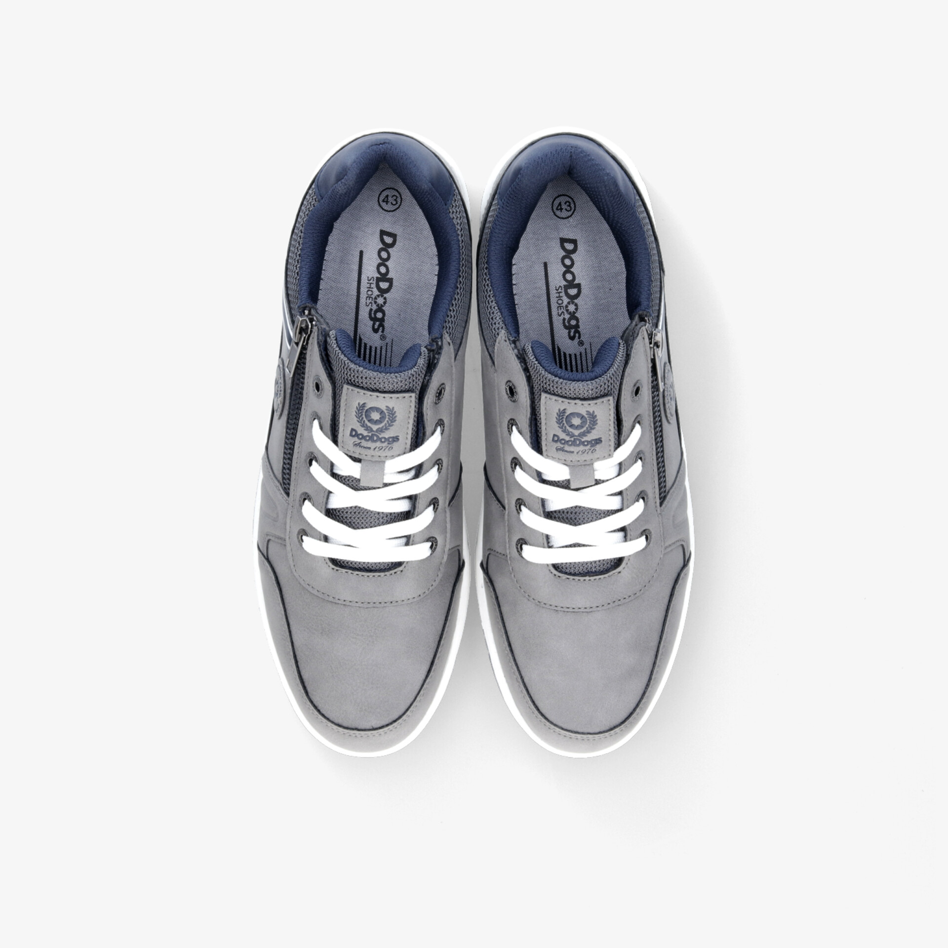 Graue Sneaker als Paar in Draufsicht mit weißen Schnürsenkeln, bequem und vielseitig für den Alltag