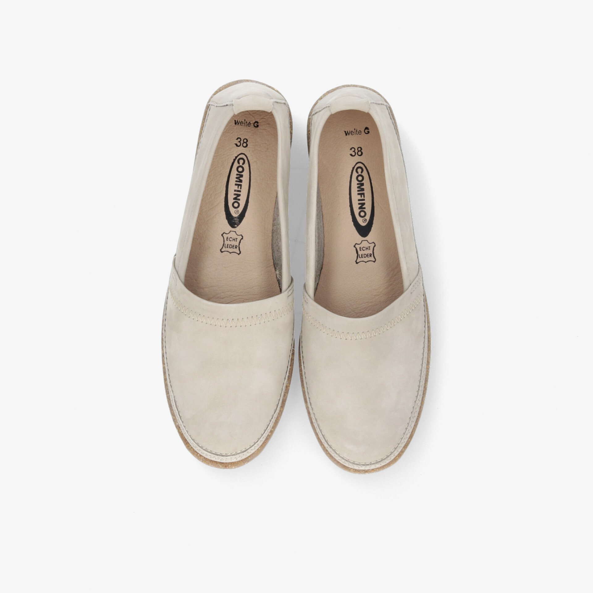 Beiges Slipper-Paar von oben, bequem und leicht mit weichem Innenfutter und schlichtem Design