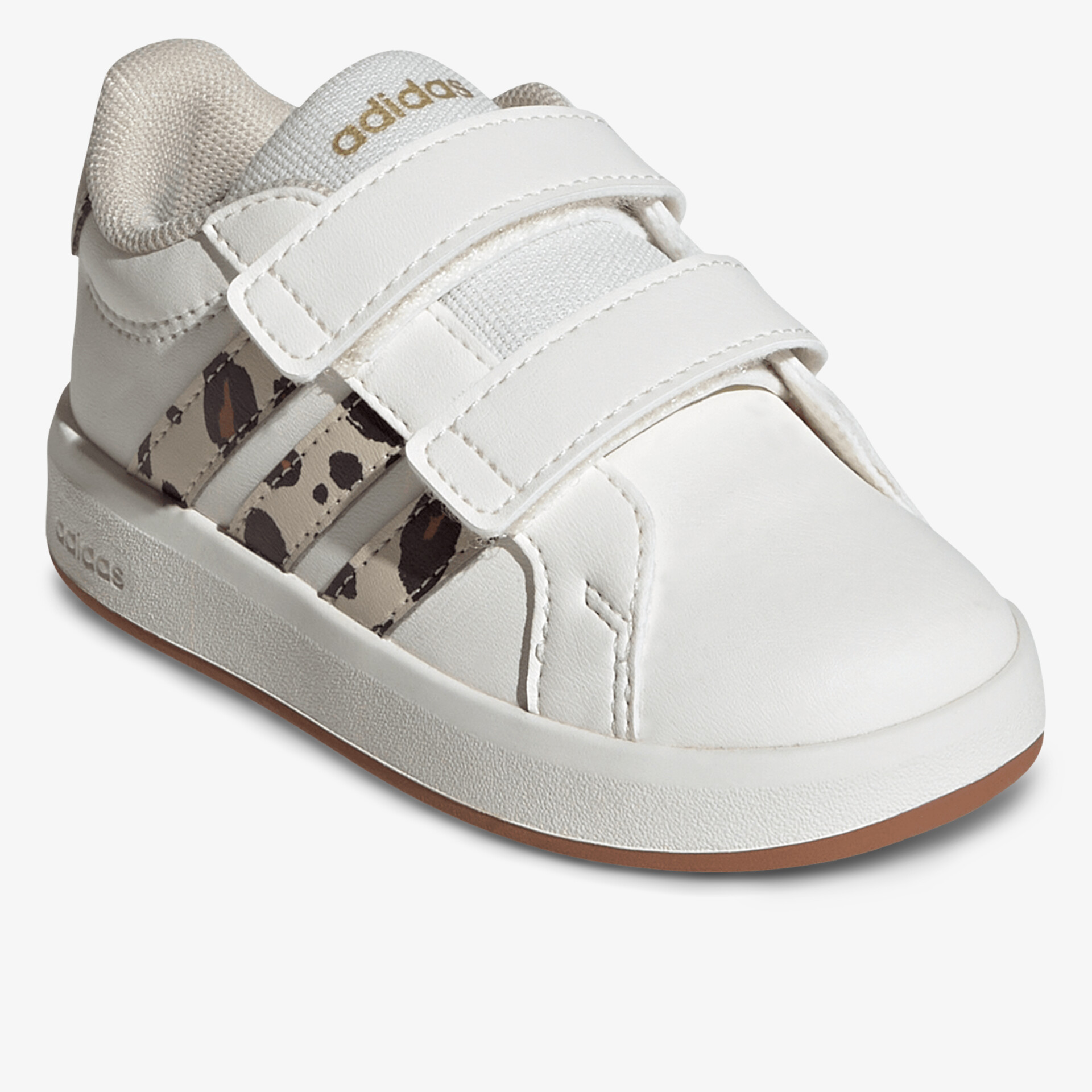 Weißer Schuh mit zwei Klettverschlüssen und gepolstertem Innenbereich für bequemen Halt