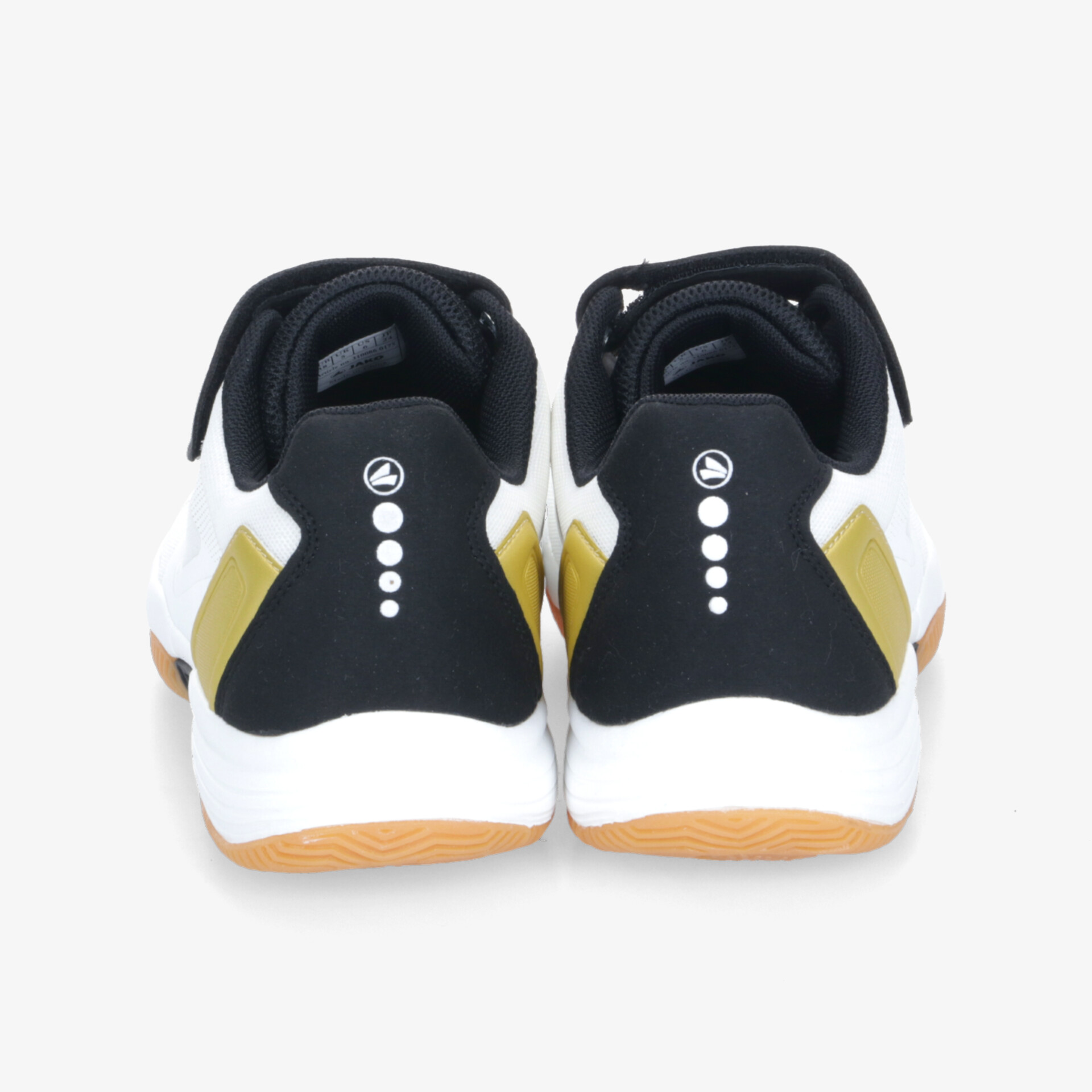 Rückansicht von weißen und schwarzen Sportschuhen mit goldfarbenen Akzenten, gepolsterter Schaft für optimalen Halt