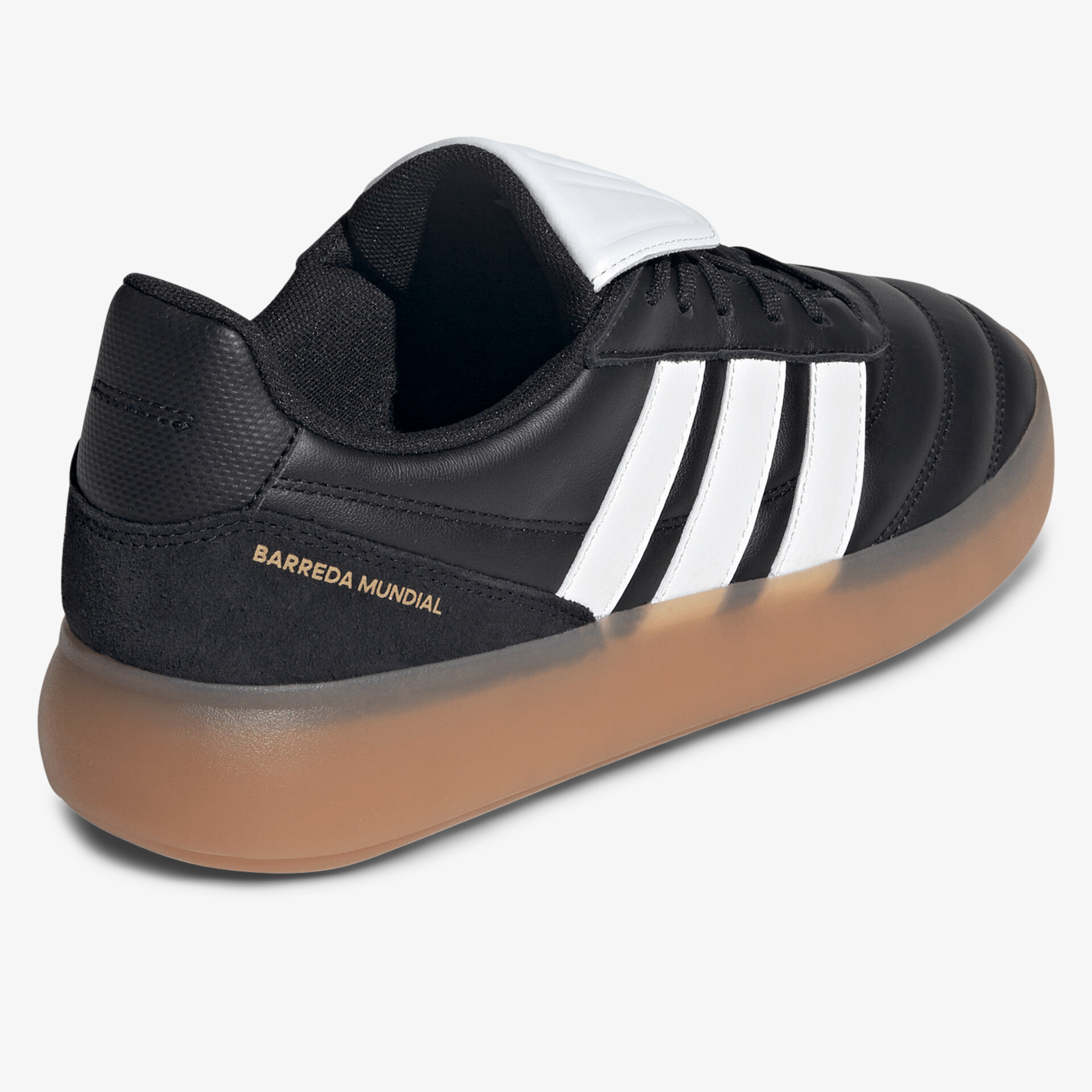 Schwarzer Sneaker mit weißen Streifen und flexibler, brauner Gummisohle für komfortables Tragen