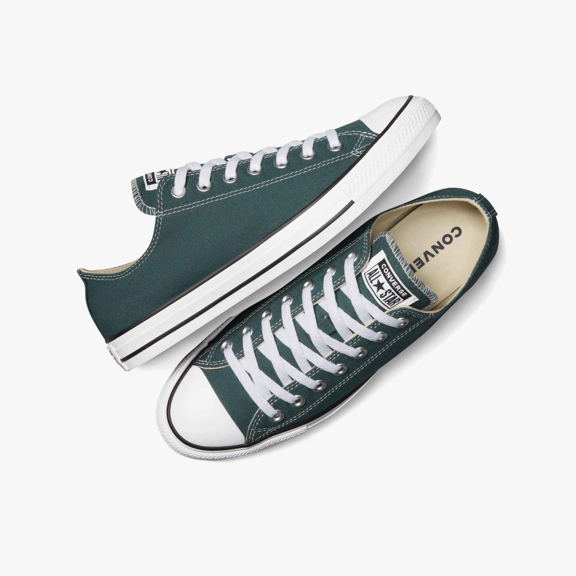 Grüne klassische Sneaker mit weißen Spitzen und Schnürsenkeln, robust und bequem für den Alltag