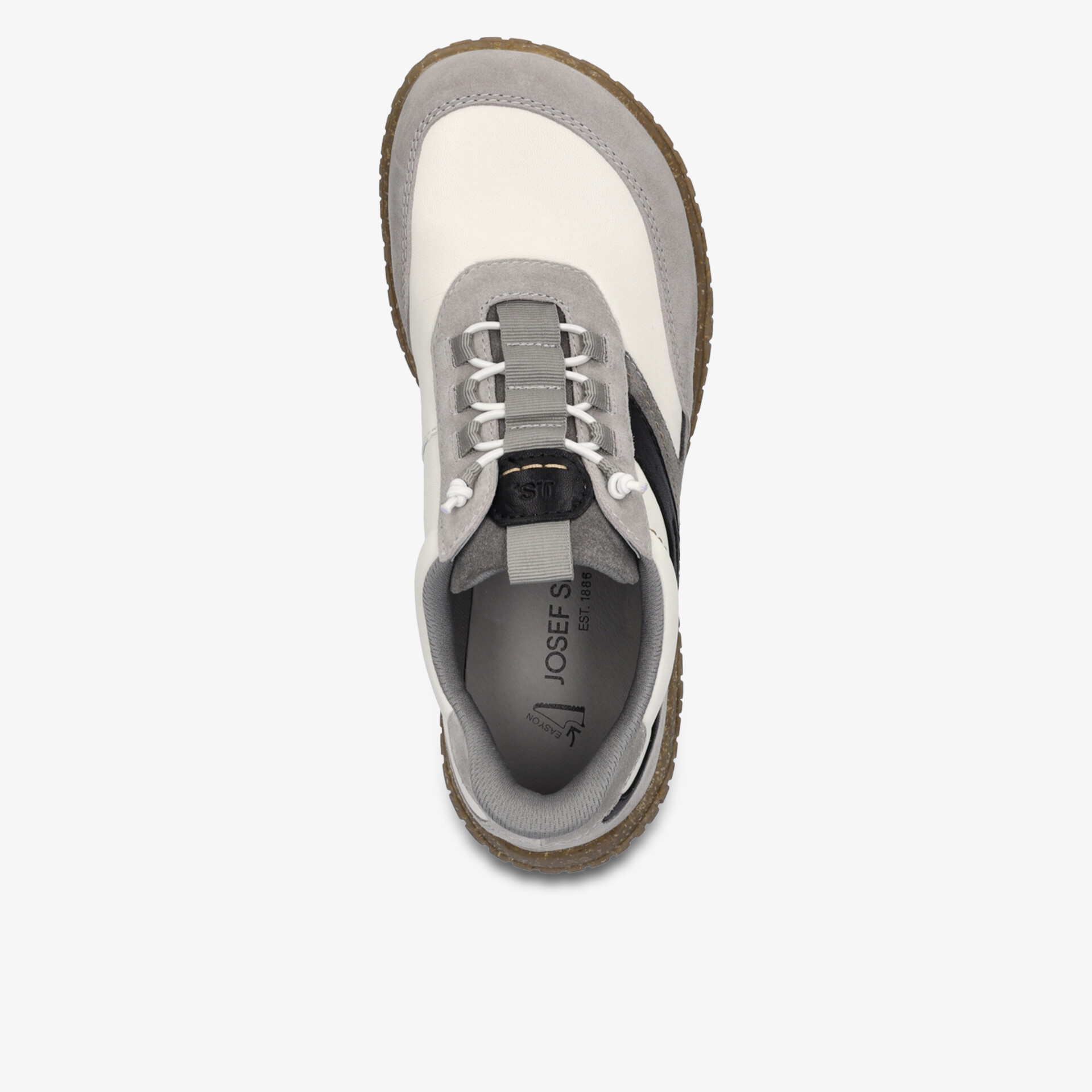 Moderner bequemer Schuh mit robuster Sohle und praktischer Schnürung in heller Farbe