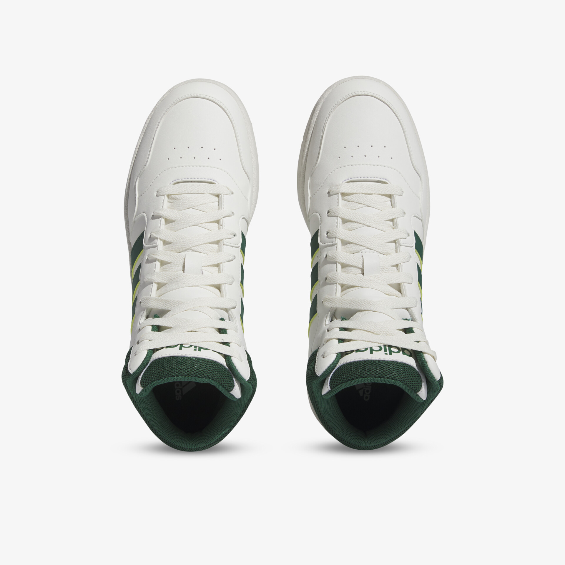 Weiße Sneakers mit grünen Akzenten, sportliches Design für hohen Komfort und Stil.