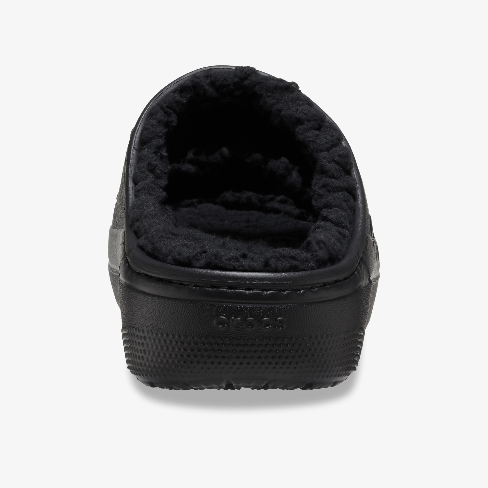 Schwarzer Hausschuh mit weichem, flauschigem Innenfutter und rutschfester robuster Sohle, Rückansicht