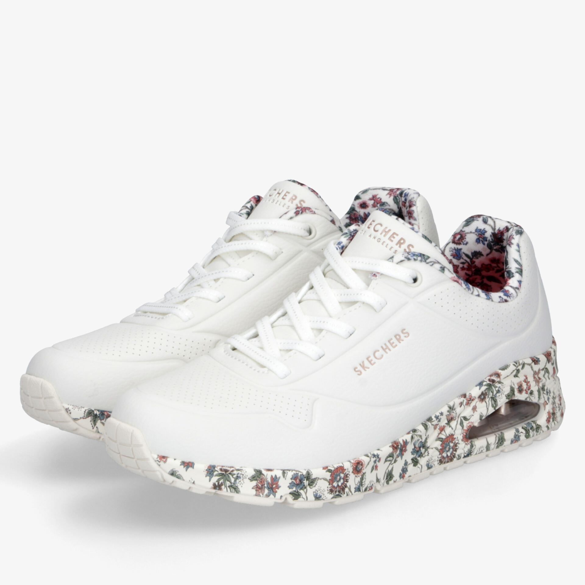 Weißer Sneaker mit floralem Muster, gepolstertem Einstieg und leichter, flexibler Sohle für hohen Tragekomfort