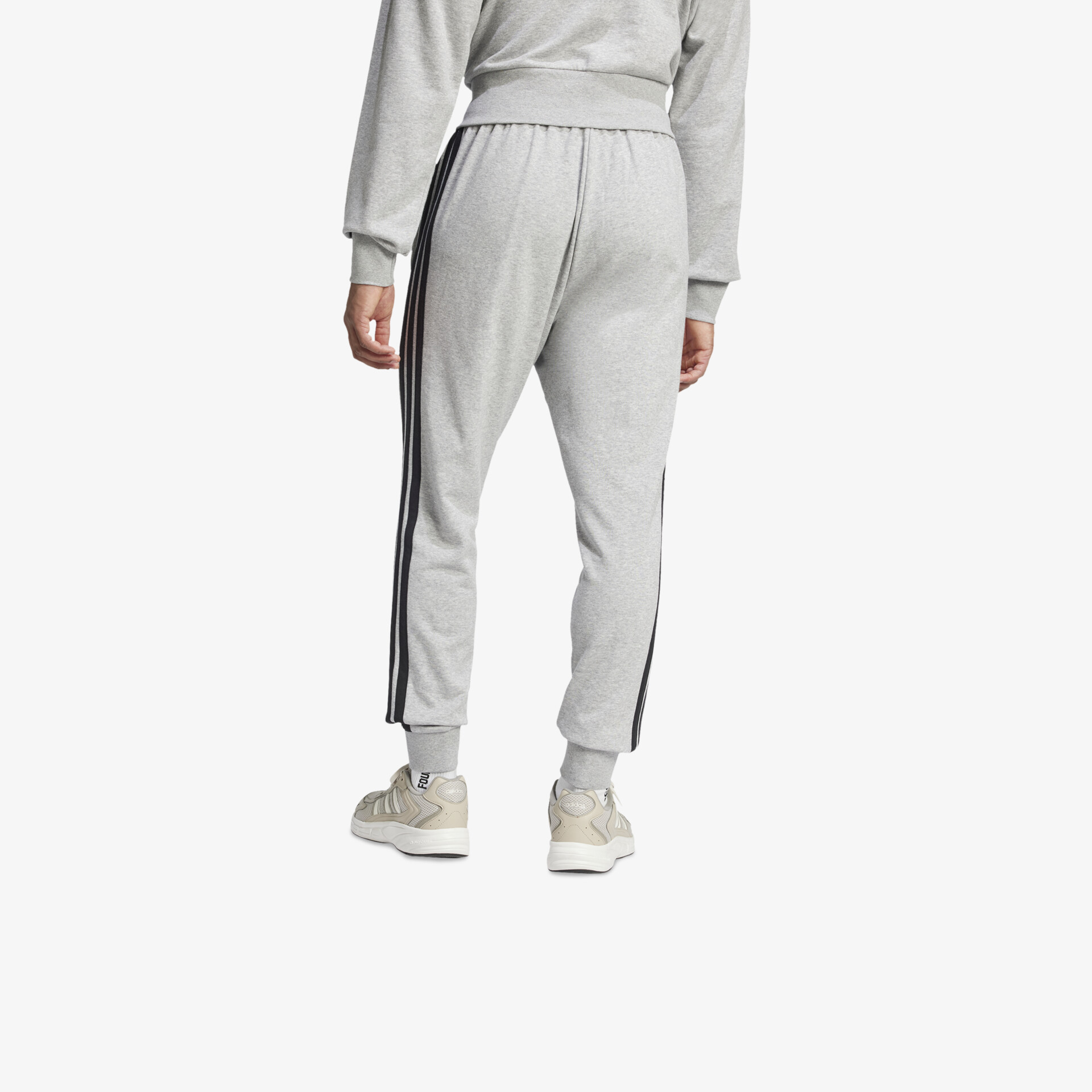 Graue Jogginghose mit elastischem Bund und seitlichem Streifen in sportlicher bequemer Passform von hinten