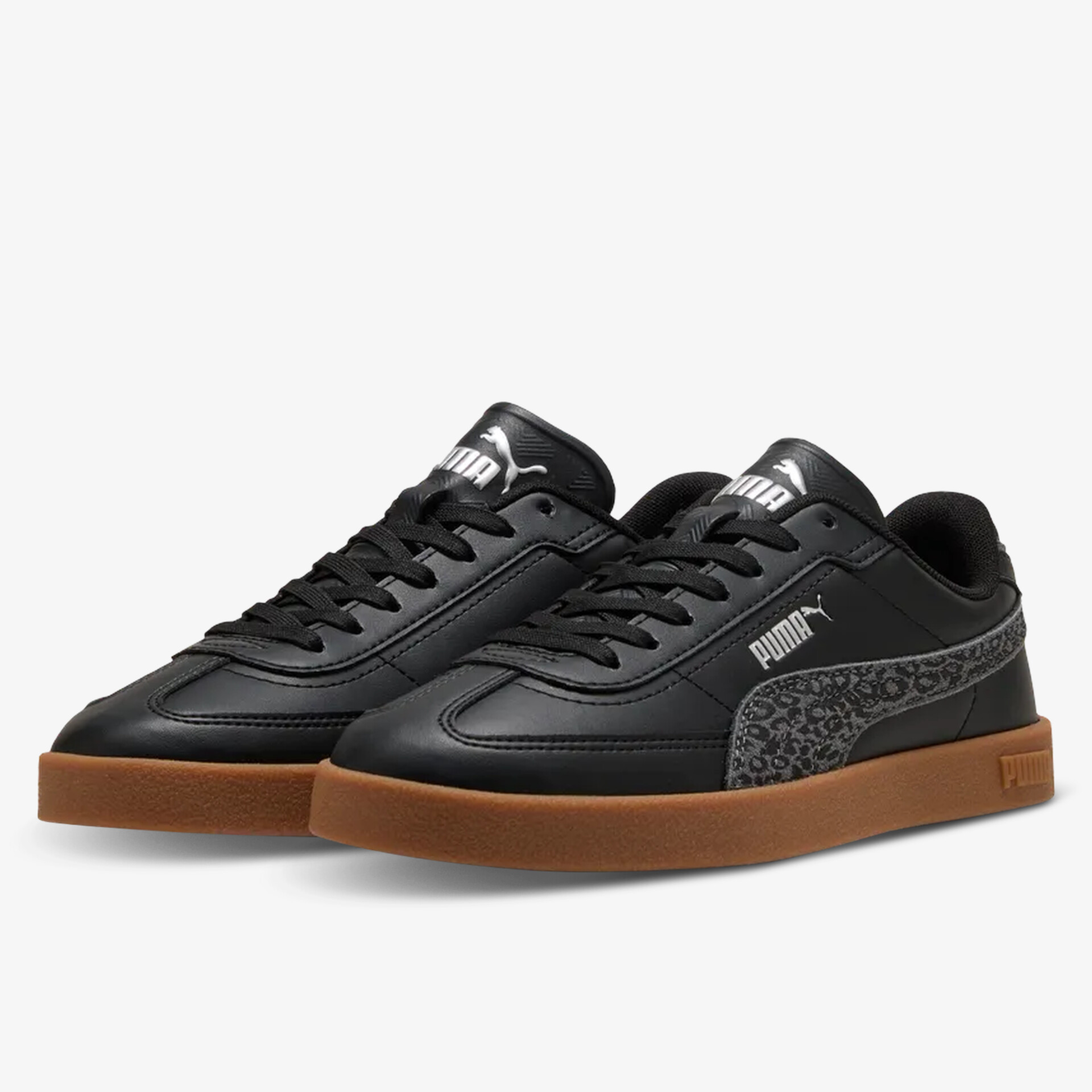 Schwarze Puma Sneaker mit brauner Gummisohle und komfortablem Design, ideal für Alltag und Freizeit