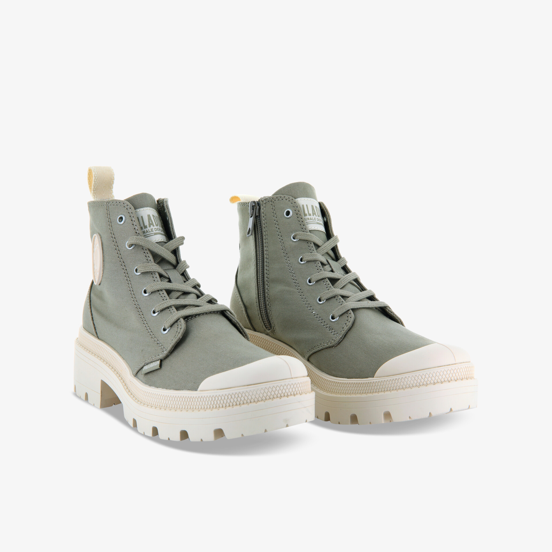 Modische grüne Boots mit robuster Sohle und praktischem Reißverschluss im modernen urbanen Design.