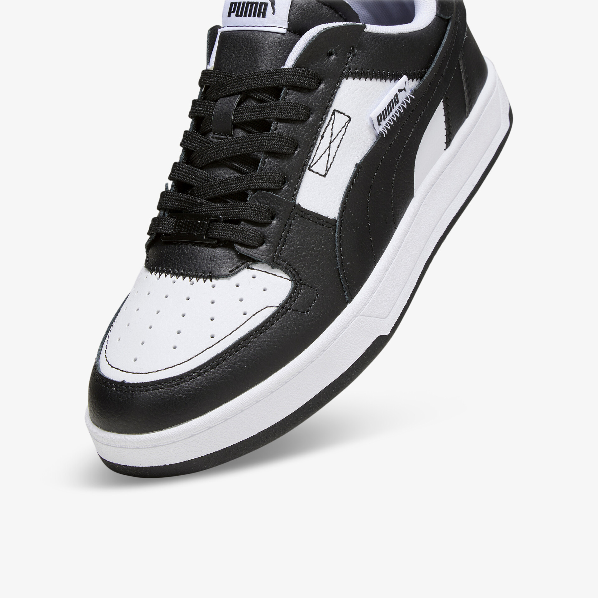 Sportlicher schwarz-weißer Sneaker aus Leder mit stabiler Sohle und bequemer Passform