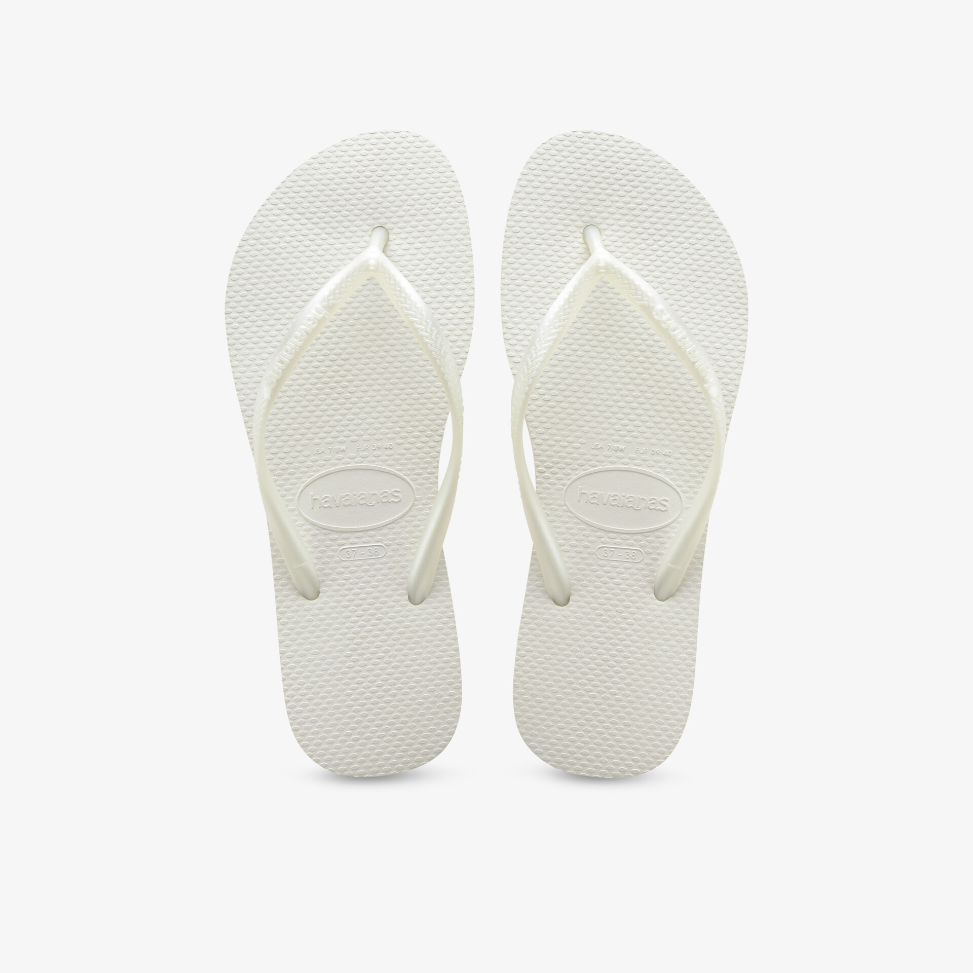 Bequeme, stilvolle weiße Flip-Flops, klassisches Design, ideal für entspannte Sommertage am Strand oder Pool.