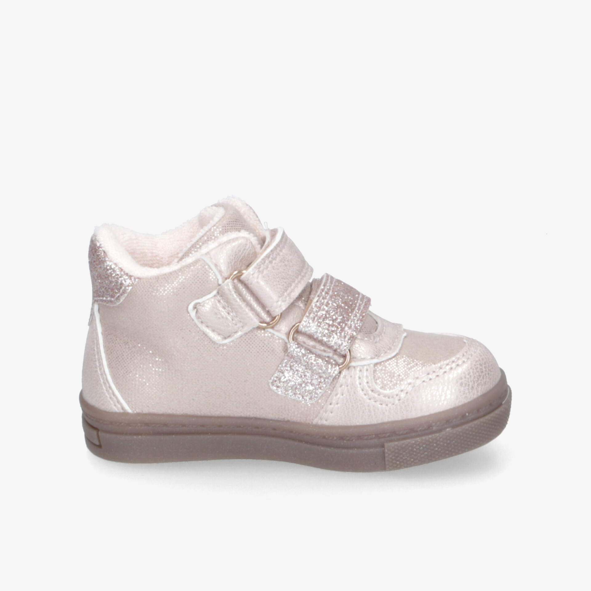 Seitliche Ansicht eines bequemen Kinderschuhs mit robustem Sohlenrand und verstellbaren Klettverschlüssen