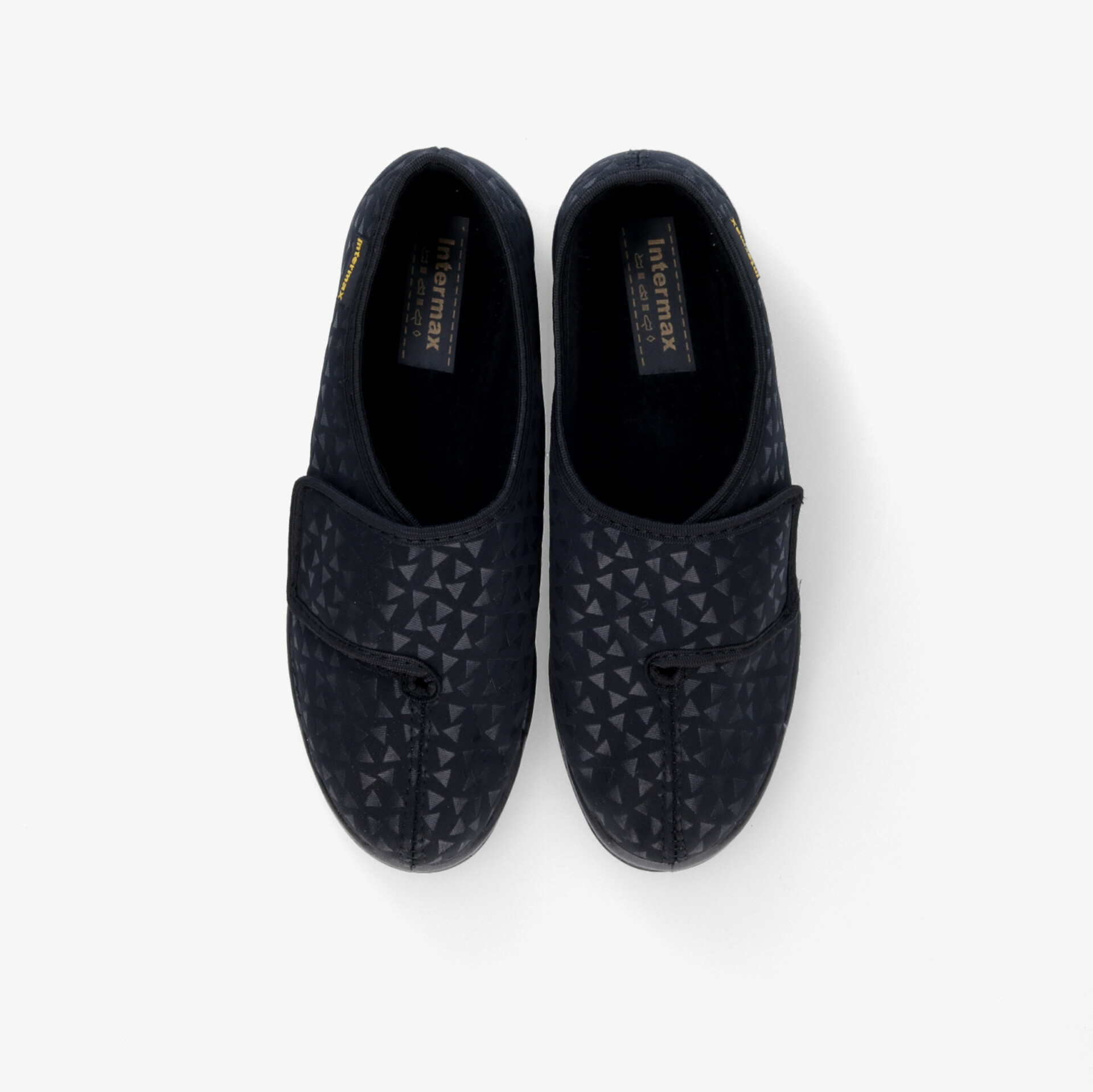 Elegante schwarze Slipper mit dezentem Muster und rutschfester Sohle für stilvollen Tragekomfort.