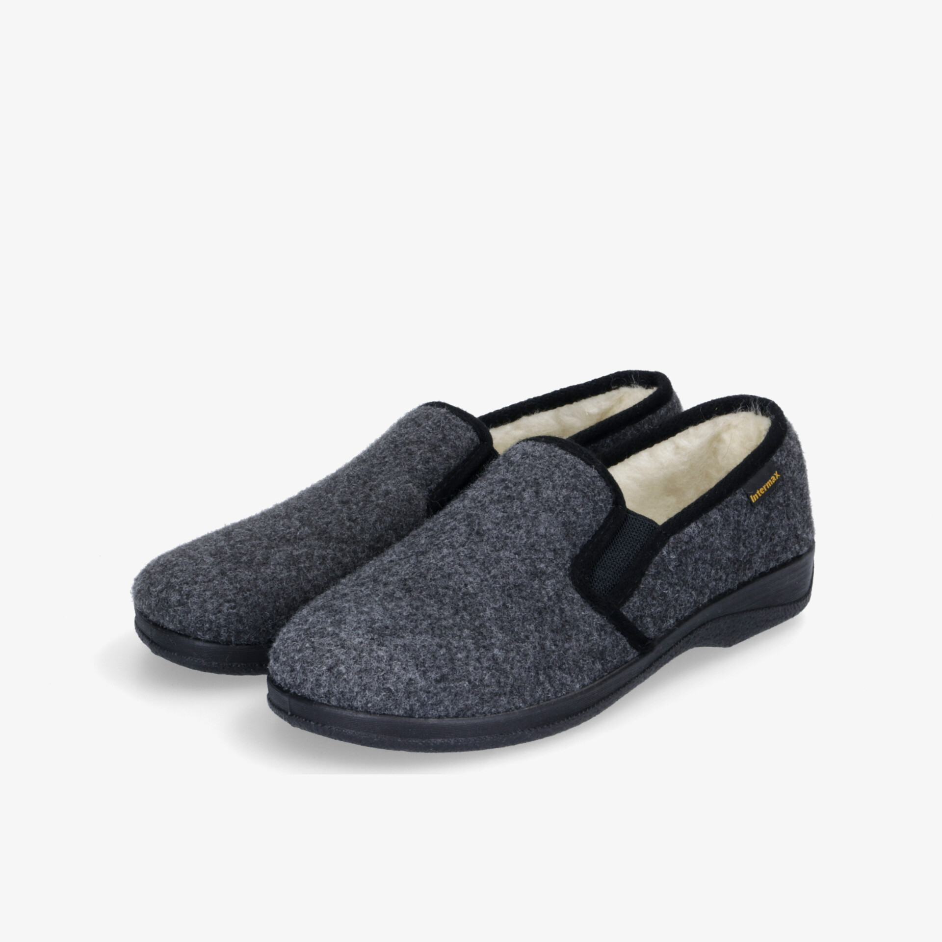 Graue, gemütliche Hausschuhe mit weichem Innenfutter und rutschfester Sohle für maximalen Komfort im Alltag.
